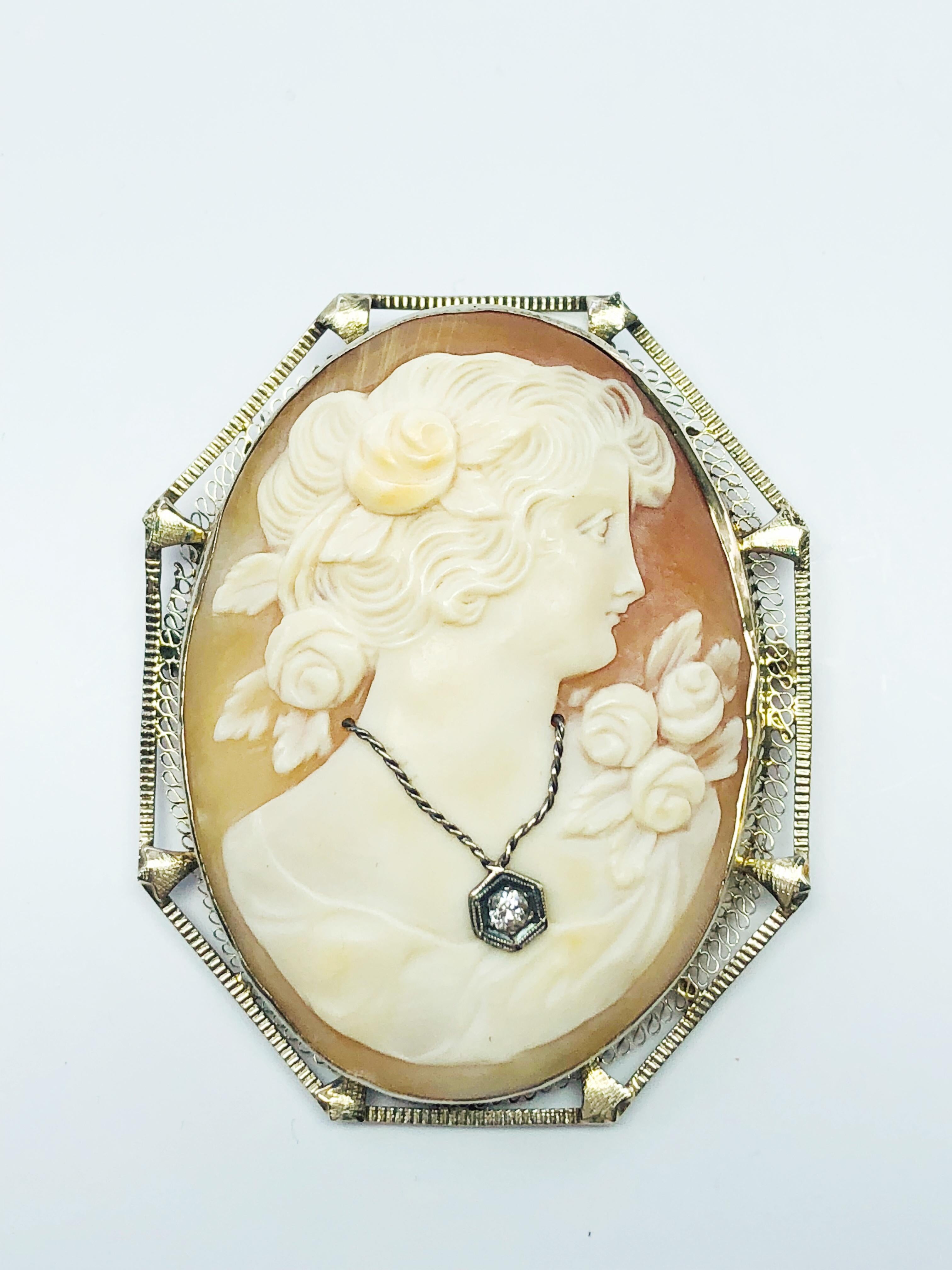 This is a very rare, Victorian, Hand carved, Estate, 18K White Gold and shell oval cameo. This cameo is a ladies bust wearing a gorgeous diamond necklace.
This Piece is from a large collection from a very large estate. The pieces were priced