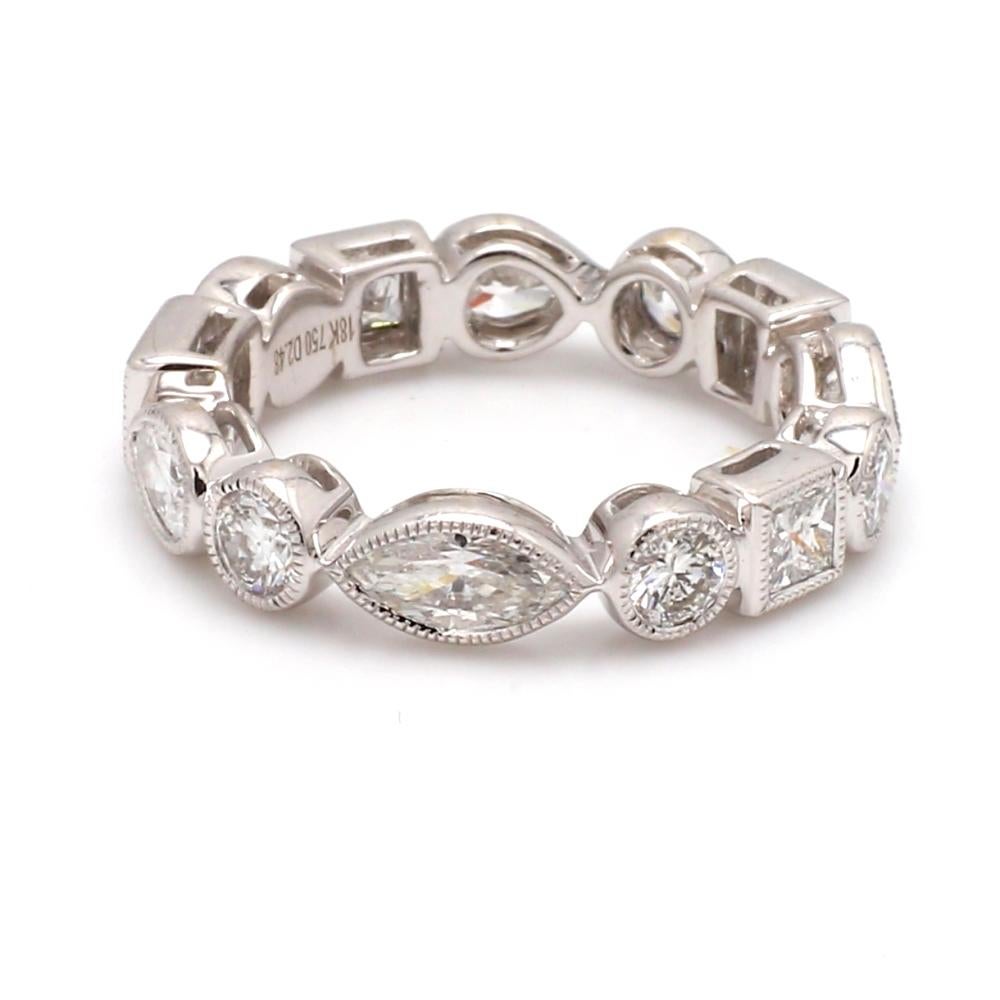 18K white gold, diamond eternity band. Band is set with thirteen (13) diamonds weighing 2.48ctw; one (1) marquise cut, one (1) emerald cut, three (3) pear brilliant cut, three (3) princess cut, and five (5) round brilliant cut diamonds. Band weighs