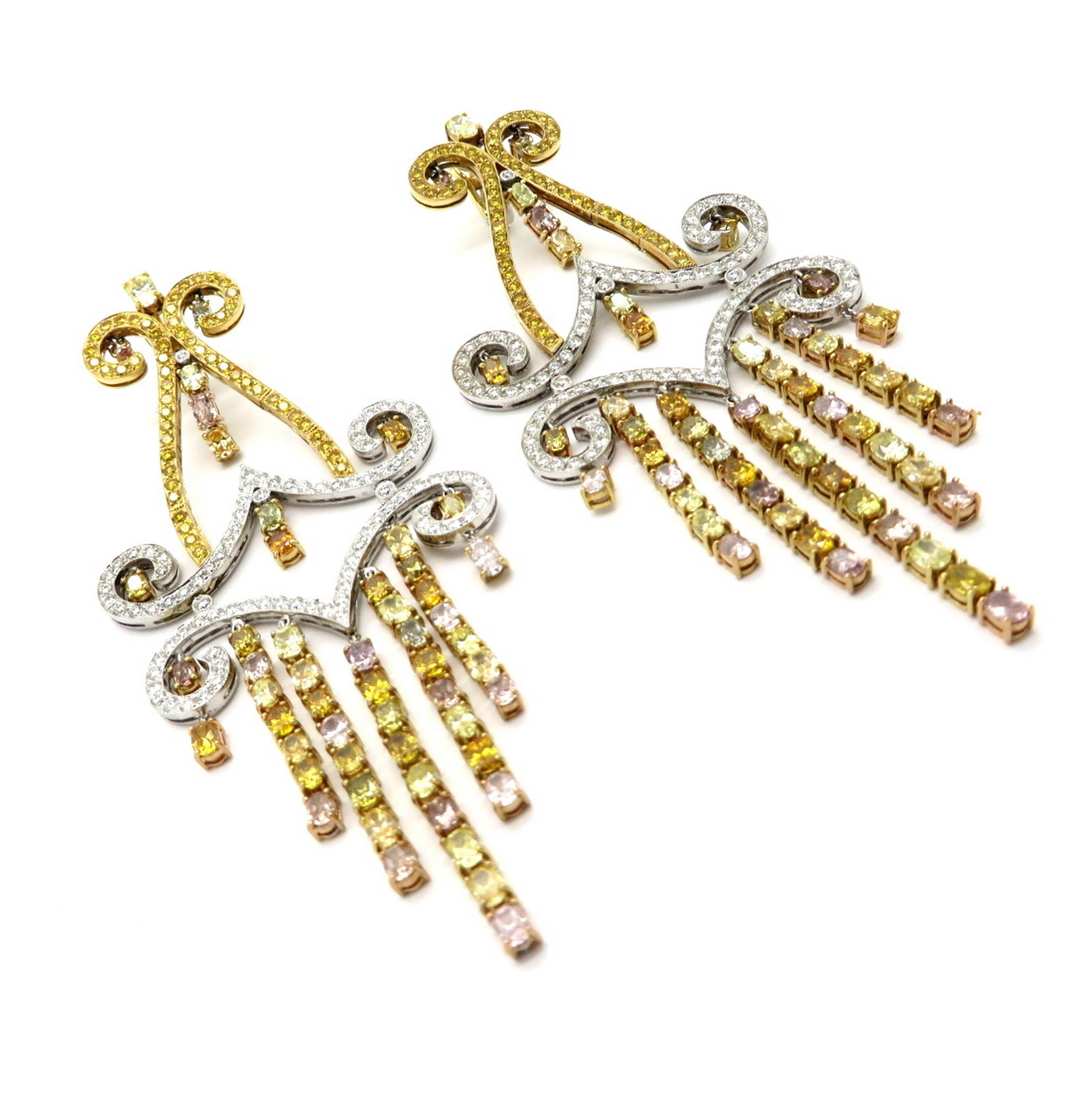 Estate 18K 16.62 carat fancy color multi shape diamond chandelier dangle earrings. Featuring numerous oval and round brilliant cut fancy yellow, fancy pink, and white diamonds, prong and bead set, with various measurements, weighing approximately