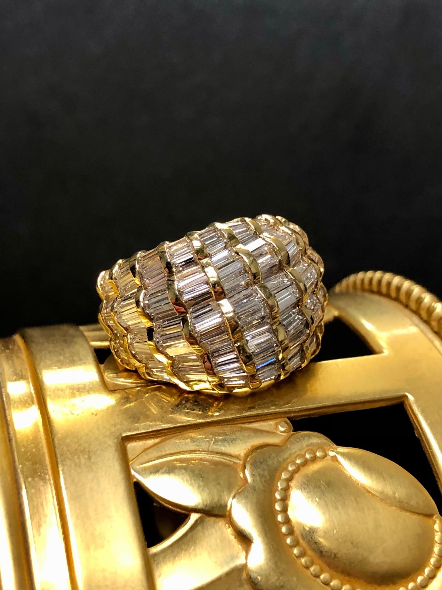 
A beautiful cocktail ring done in 18K yellow gold set with approximately 6cttw in tapered and straight baguette cut diamonds. All stones average G-I in color and Vs1-Si1 clarity.


Dimensions/Weight:

Ring measures .60” wide and weighs 5.7dwt. Size
