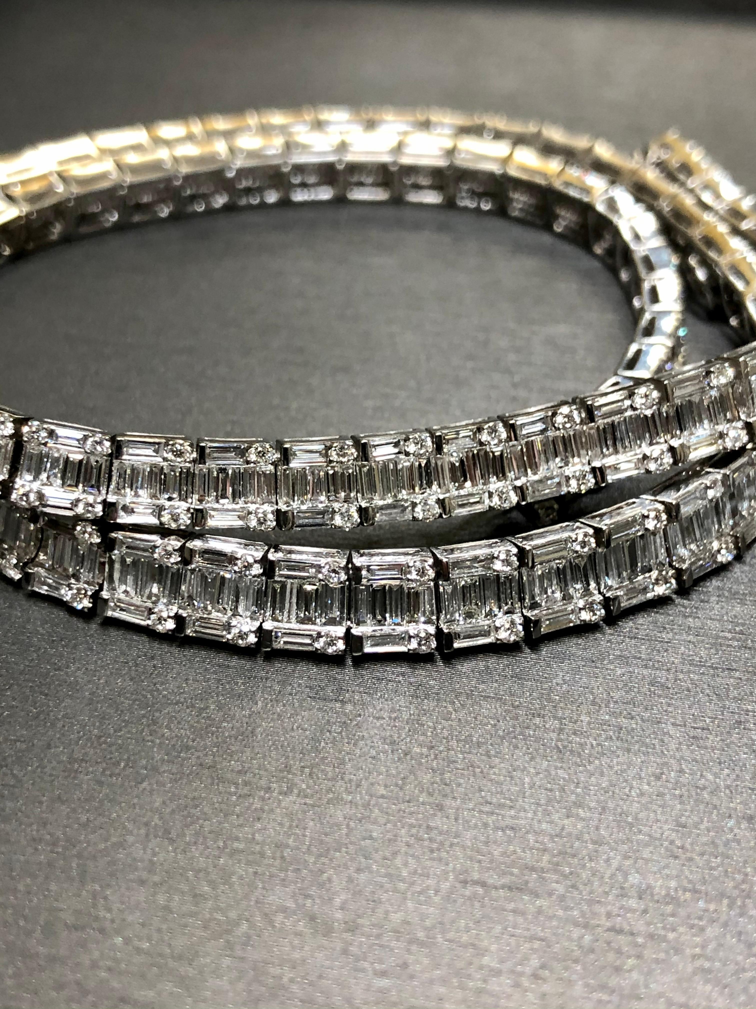 
An absolutely stunning piece that makes no excuses… ZERO. Done in 18K white gold, this incredible necklace is set with approximately and conservatively 35.20cttw in G-I color Vs1-2 clarity baguette and round diamonds. There are no gaps, no chips…