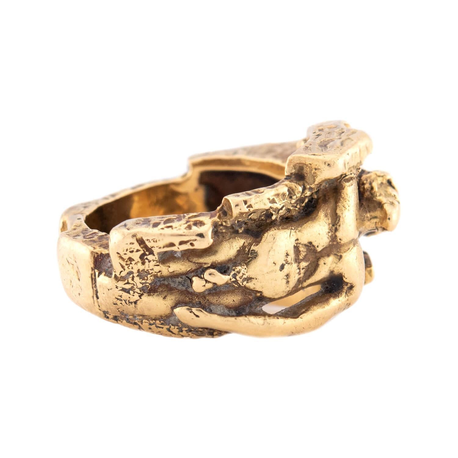 A fabulous and bold brutalist-style ring! This unique three-dimensional ring is crafted in 18k yellow gold, and depicts the curved body of a naked man. The body of the man is adorned with intricate engravings, which adds to the lifelike look of the