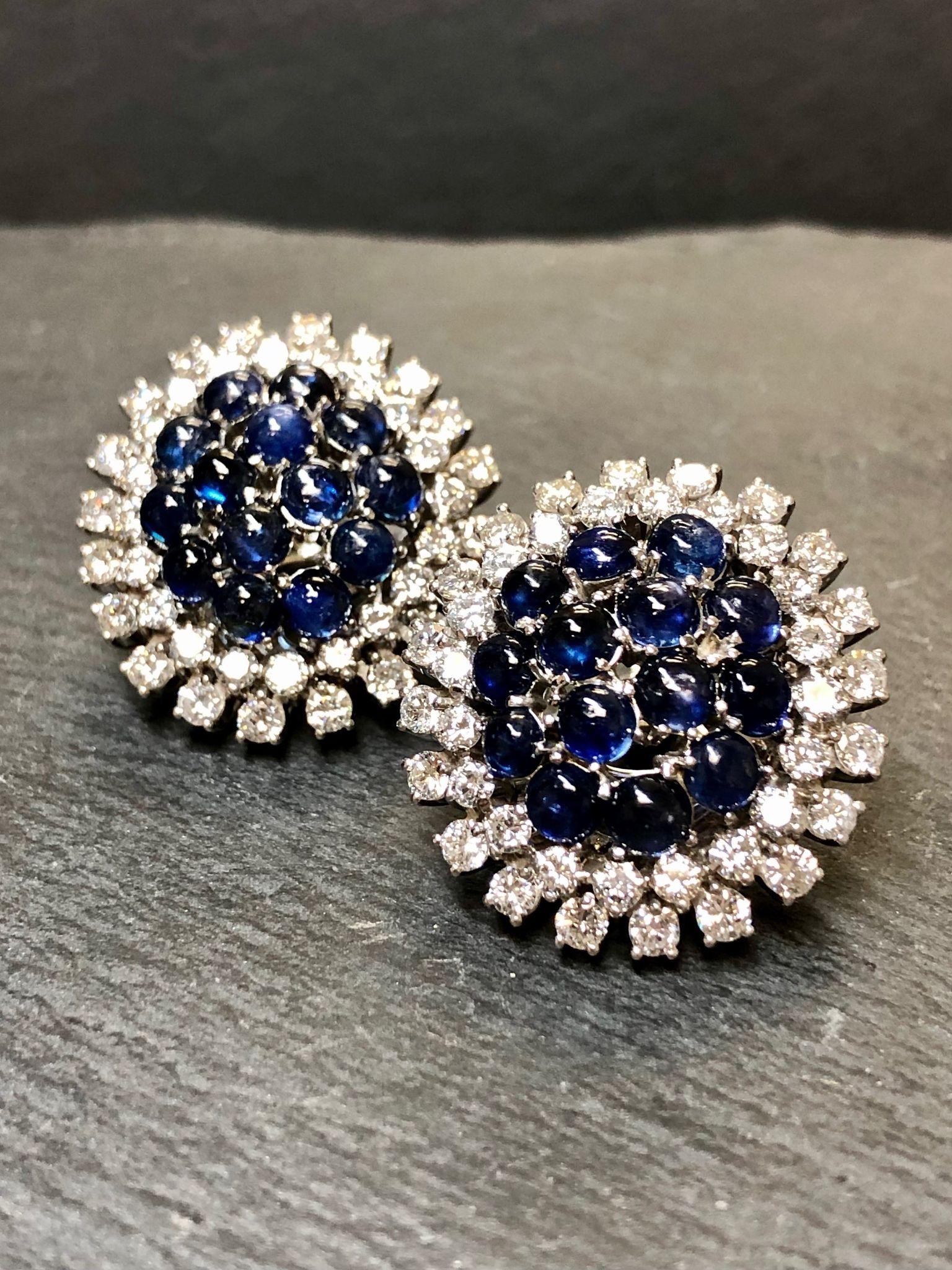 Cocktail earrings done in 18K white gold set with approximately 5.80cttw H-J color Vs clarity diamonds and 5.60cttw in natural cabochon sapphires.

Dimensions/Weight
1” in diameter. Weighs 13.5dwt.

Condition
All stones are secure and they are in