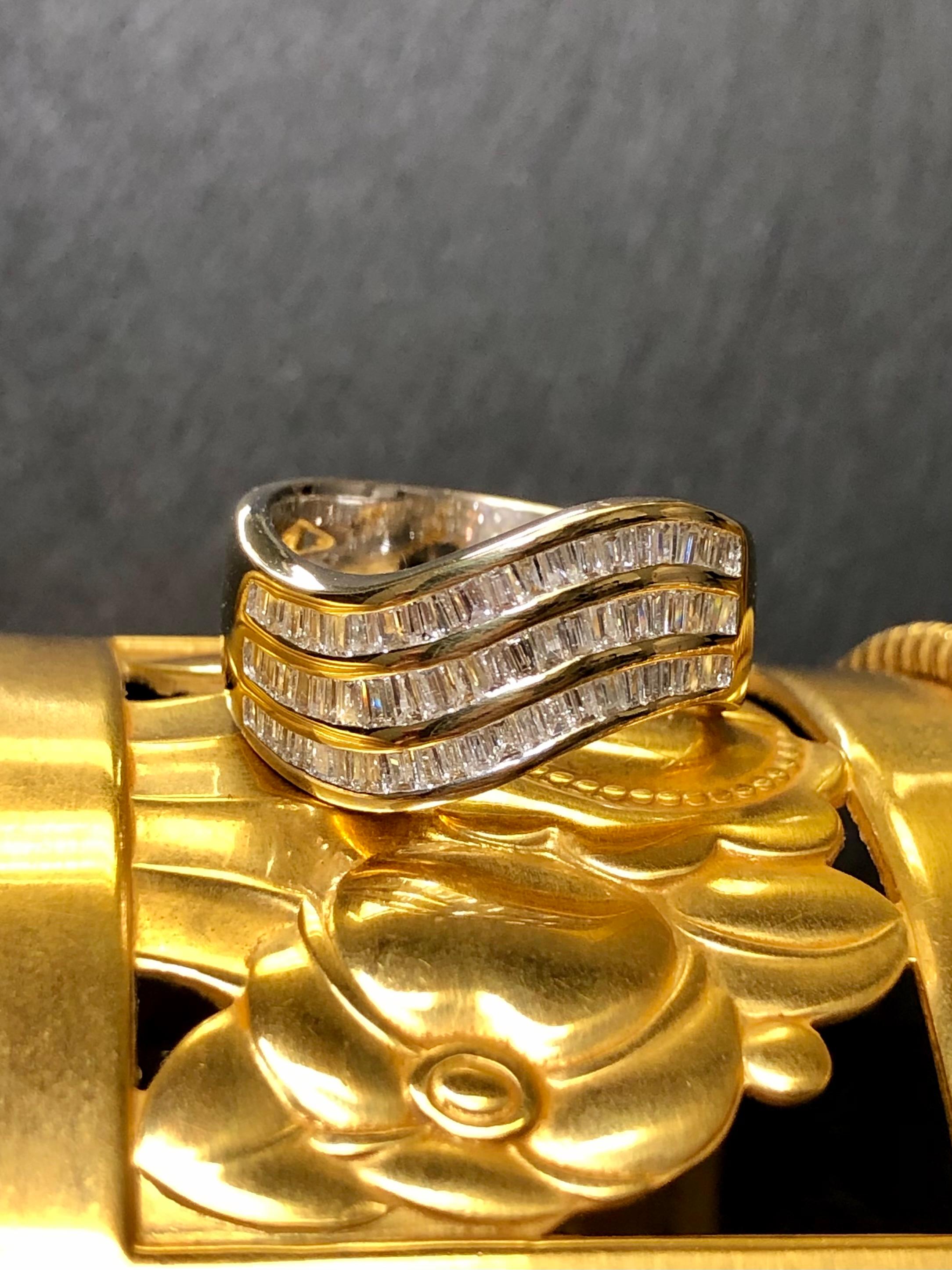 A classic band ring done in 18K yellow gold (interior of band is white gold not plated) channel set with approximately 1.60cttw in baguette diamonds being G/H color and si1/2 in clarity. A gorgeous classic look.


Dimensions/Weight:

Ring measures