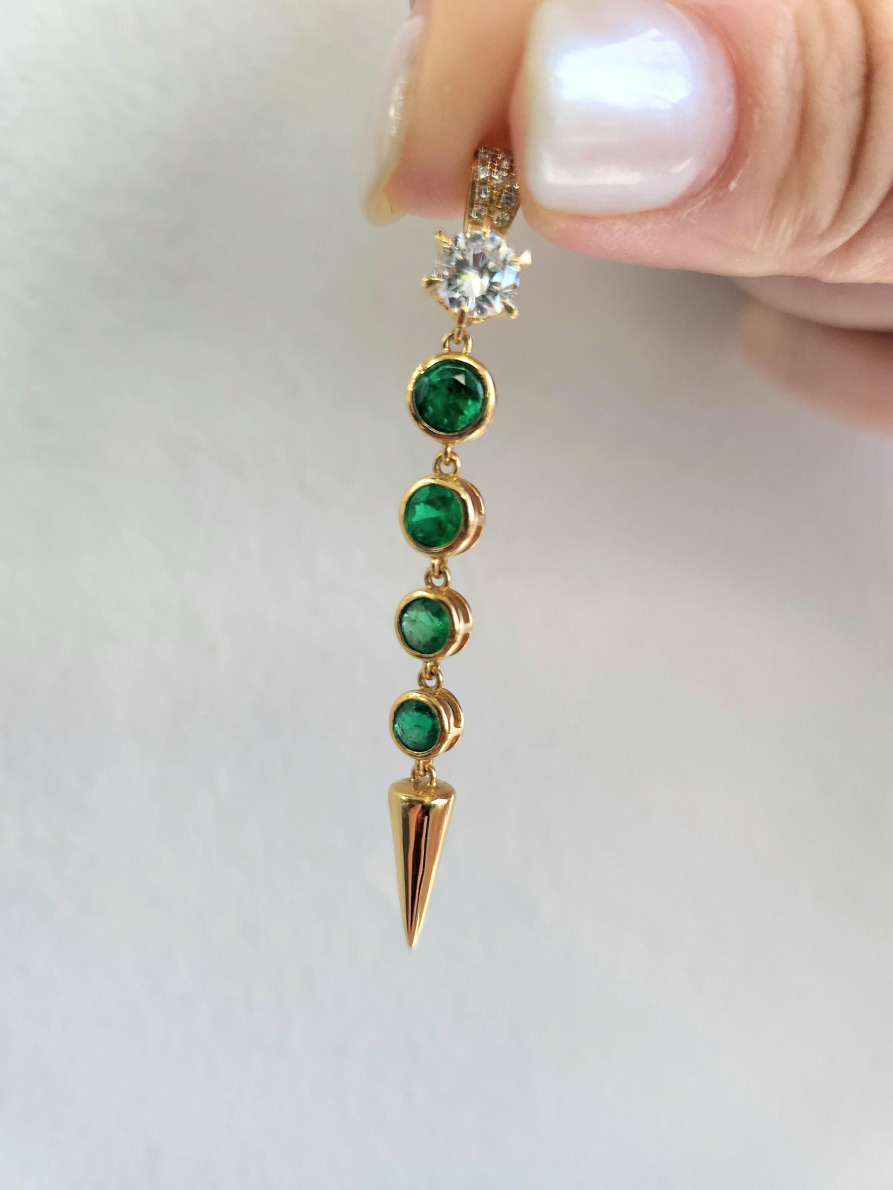 Colombian emerald and diamond bezel set drop pendant
Four round emeralds bezel set weigh ~0.78 carats
Vivid green
Round brilliant diamond six prong set
measure 5mm ~0.45 carats
D-F VS
10 diamonds micro pave set weigh ~ 0.08 carats
D-F VS
2 inch