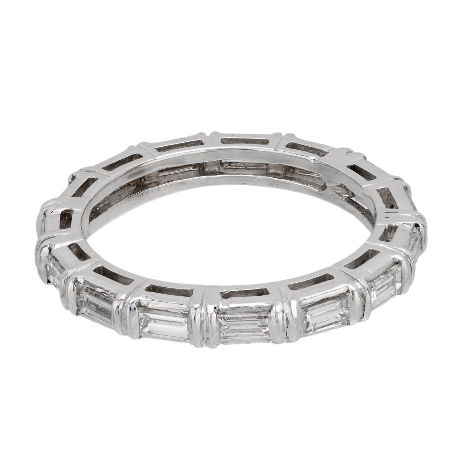 A stunning and unique diamond eternity band! This gorgeous ring is crafted in 18k white gold and holds a row of horizontally-placed baguette diamonds, which are all channel-set. The diamonds carry seamlessly all the way around the surface of the