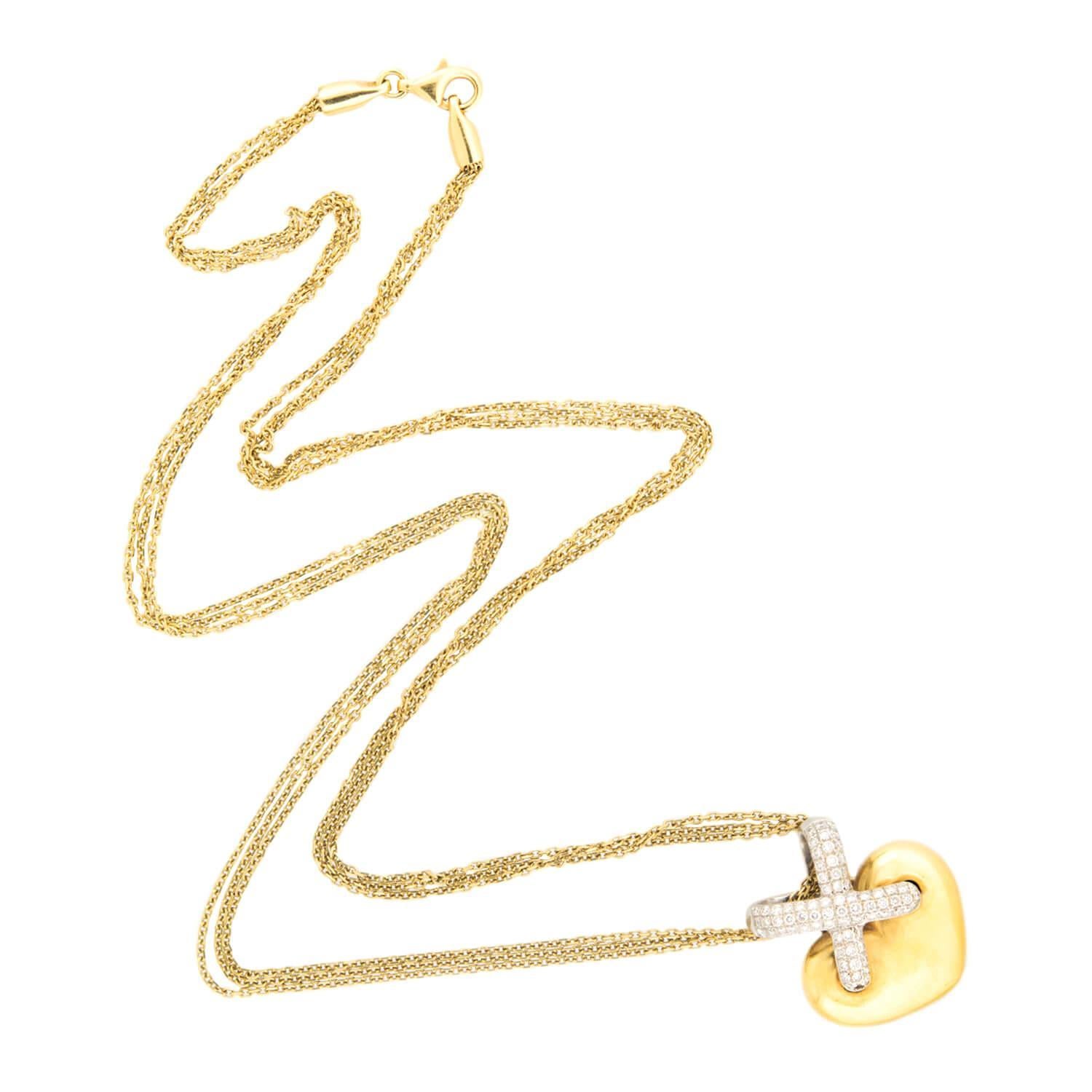 A beautiful Estate heart pendant necklace! Crafted in 18k yellow gold, this pendant necklace features a smooth and simple three-dimensional heart. The top of the heart features a small 