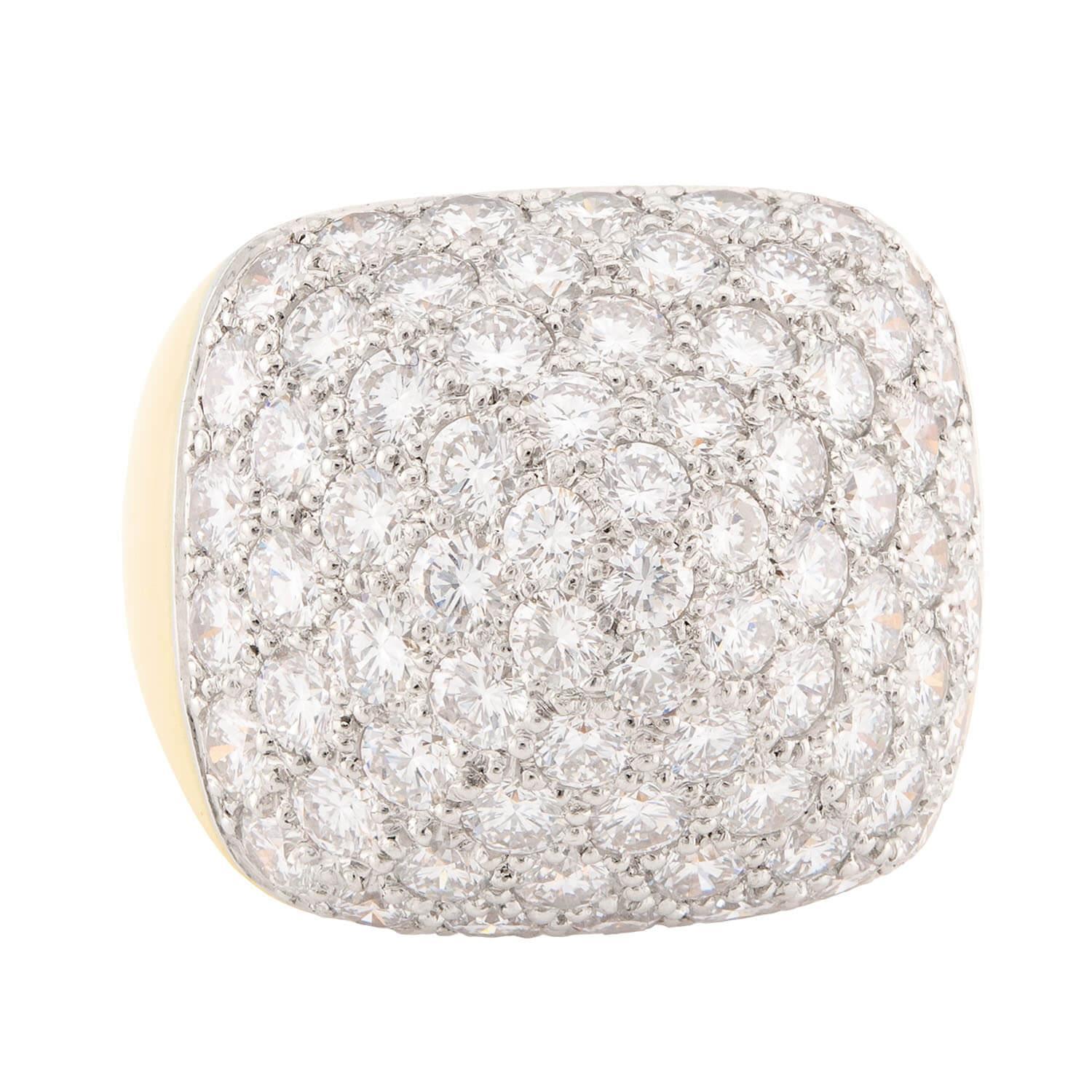 A fabulous diamond-encrusted pyramid ring! Crafted in vibrant 18k yellow gold, the front surface of the substantial ring is encrusted with modern round brilliant cut diamonds, which are all pavé set. The stones vary slightly in size, but overall
