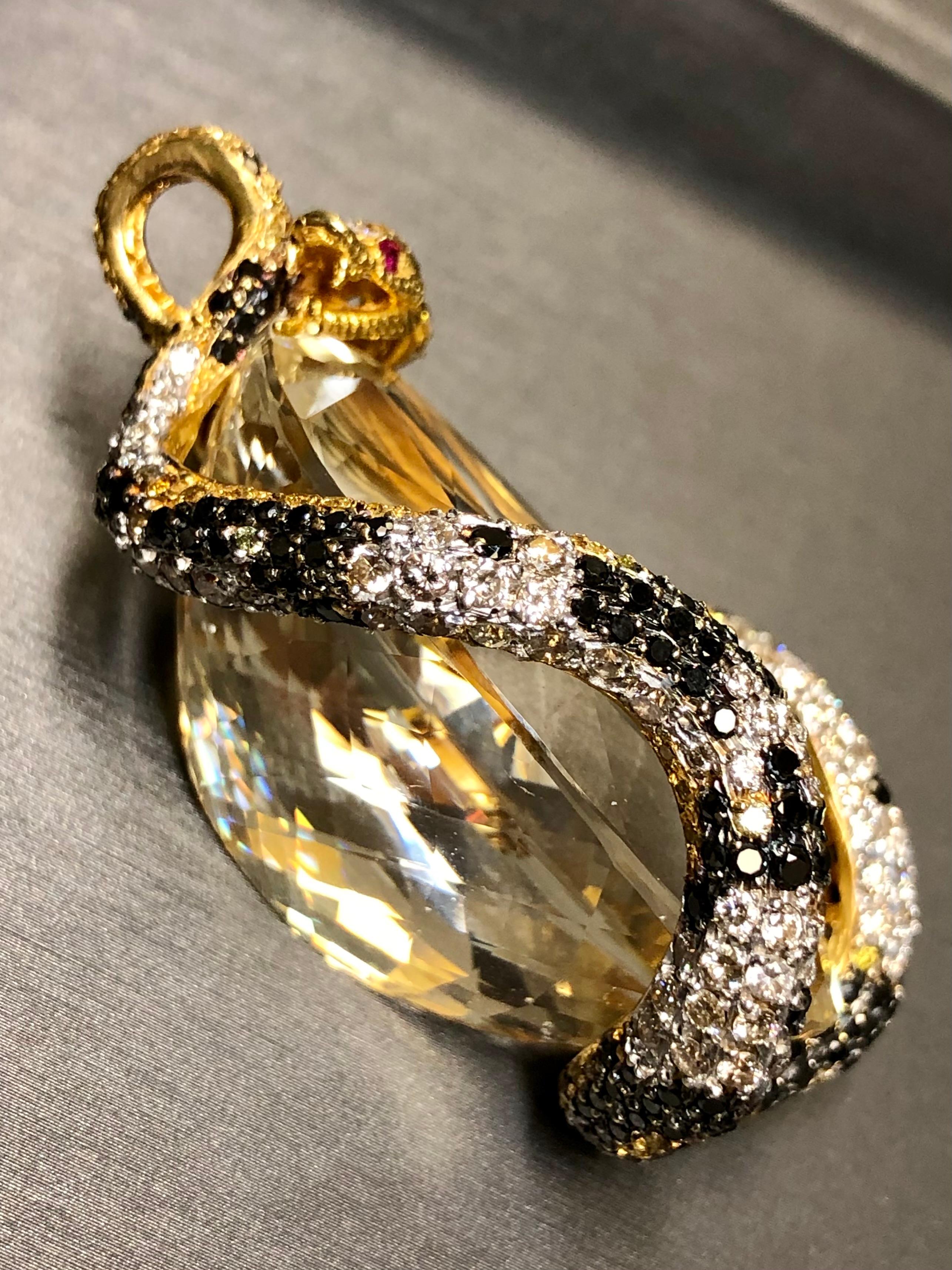 
An incredible piece and the pictures say it all. It has been crafted in 18K yellow gold and set with approximately 9cttw in white, yellow/brown and black diamonds (almost 3cttw of each color). Every centimeter of this serpent that is wrapped around