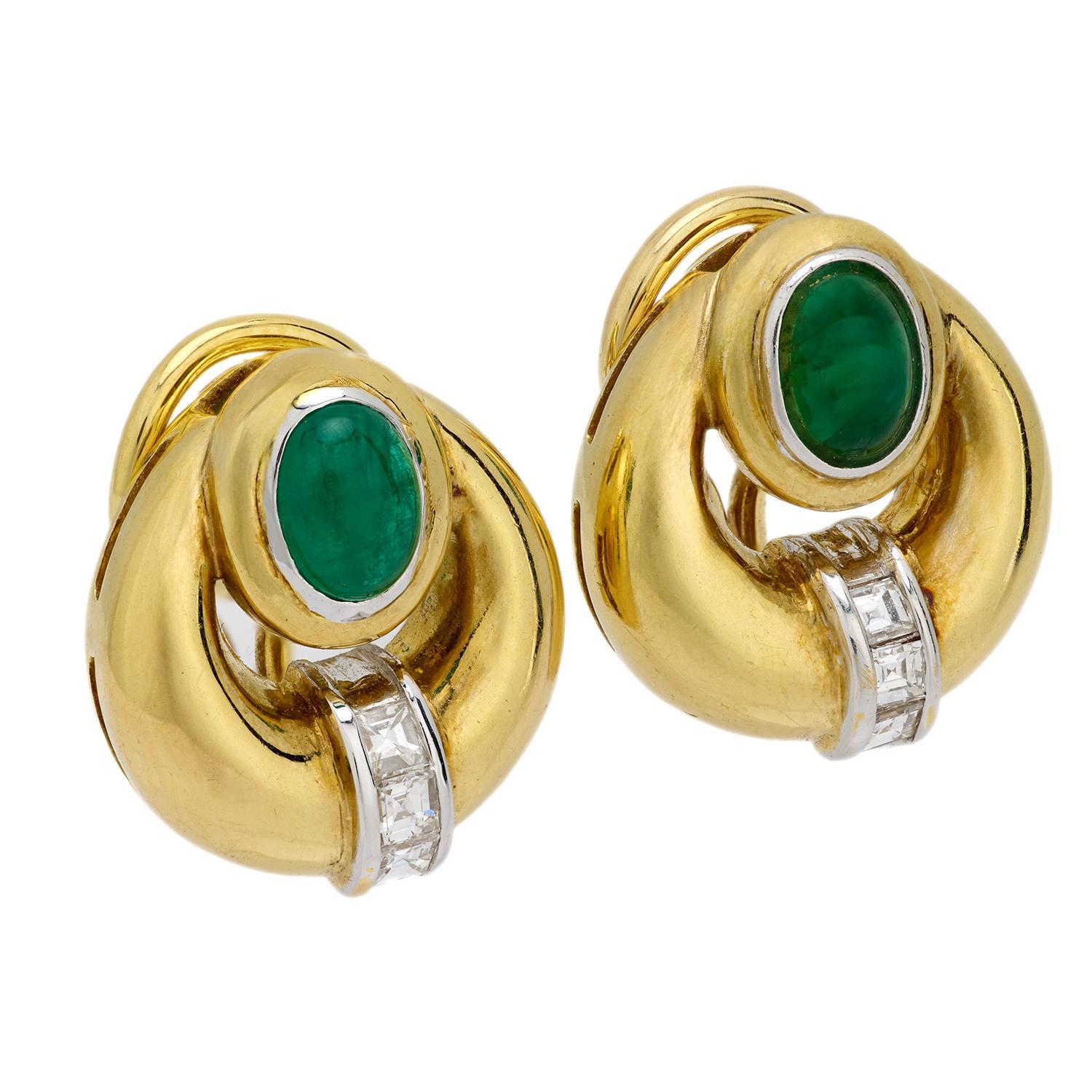 A striking pair of emerald and diamond hoop earrings! Crafted in vibrant 18k yellow gold, each earring features a smooth and simple gold crescent-shaped component. A striking emerald cabochon is located in between the two points of the