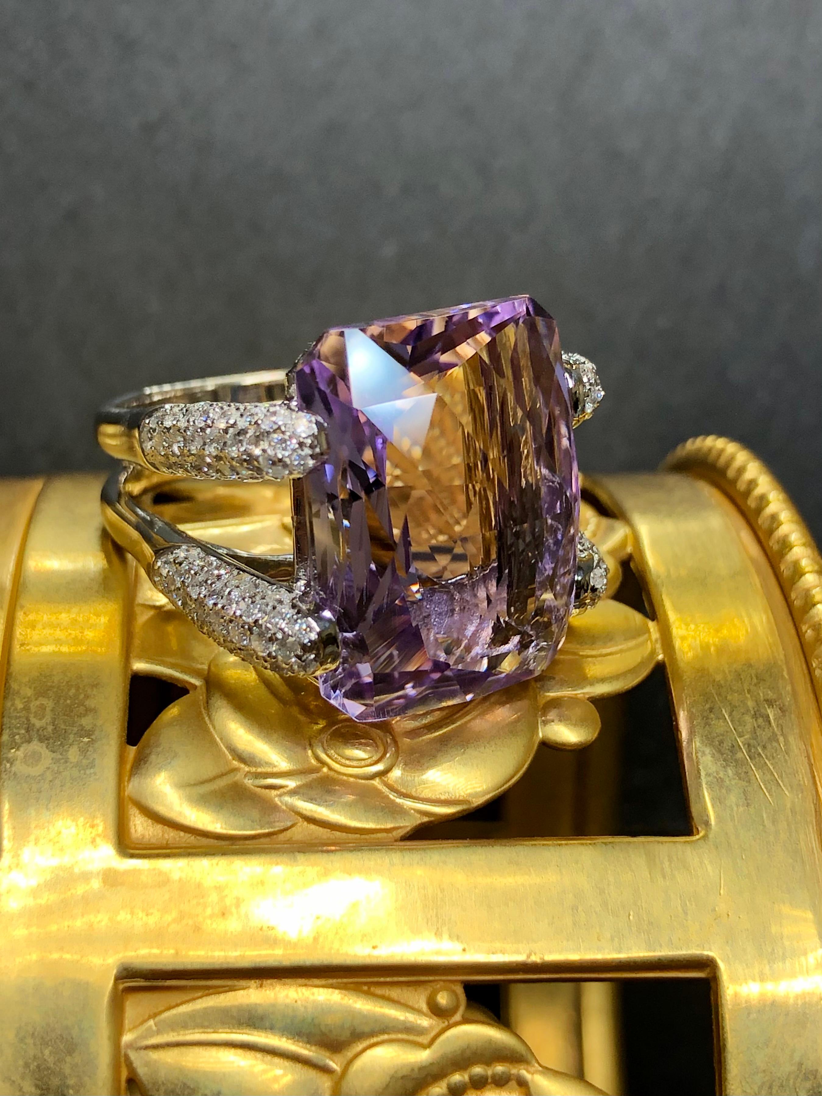 
Not all amethyst rings are created equal… obviously. Crafted in 18K white gold, this ring is centered by an approximately 21ct fantasy cut amenthyst which is surrounded by approximately 1.84cttw in pavé set H-I color Si1-i1 clarity round diamonds.