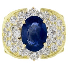Anillo de cóctel de oro de 18 quilates con zafiro oval y diamantes de 10,72 ctw GIA