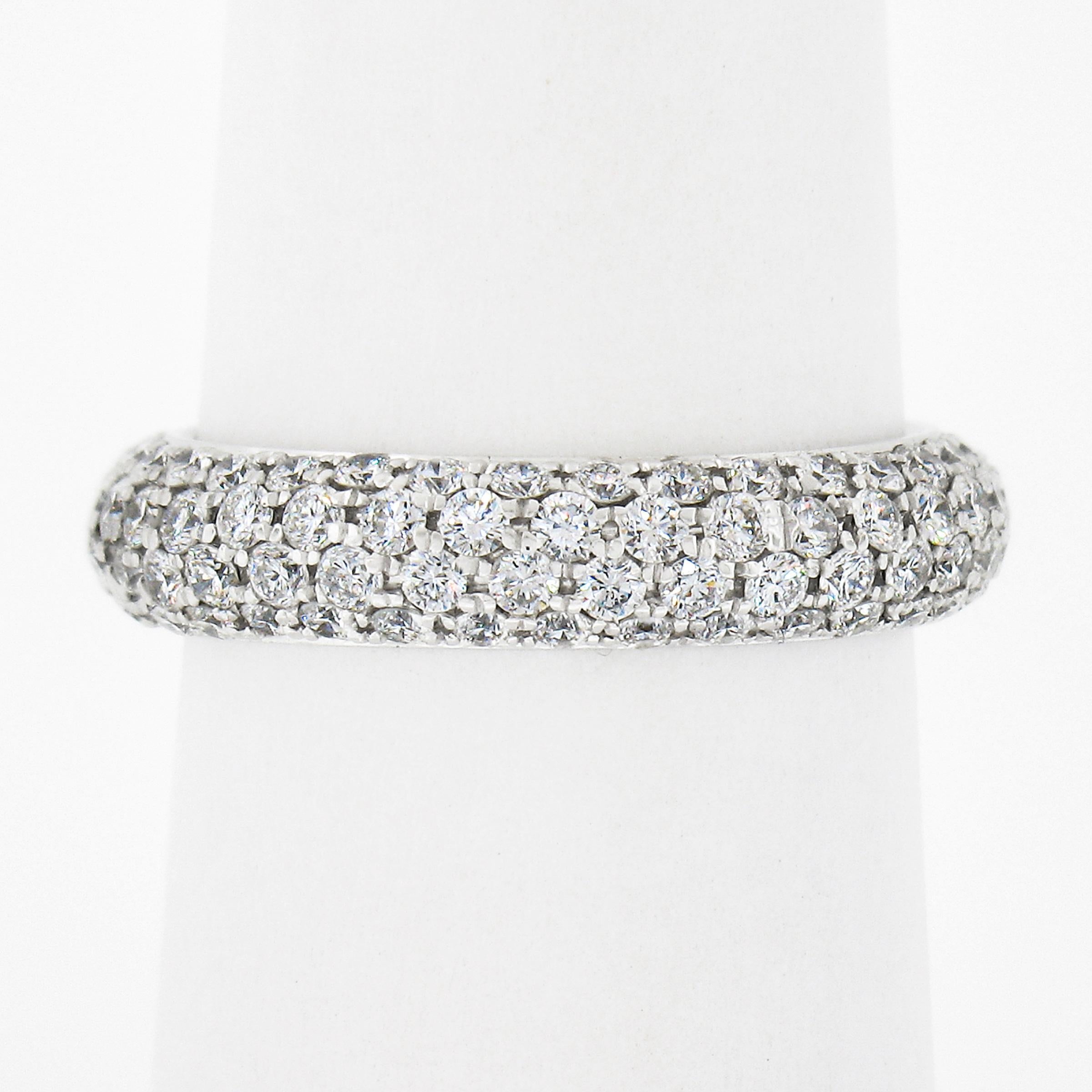This gorgeous eternity band ring is crafted in solid 18k white gold and features 4 rows of stunning diamonds elegantly drenched throughout its domed surface in a neat pave setting style. The diamonds are very nice quality having wonderful G/H color,