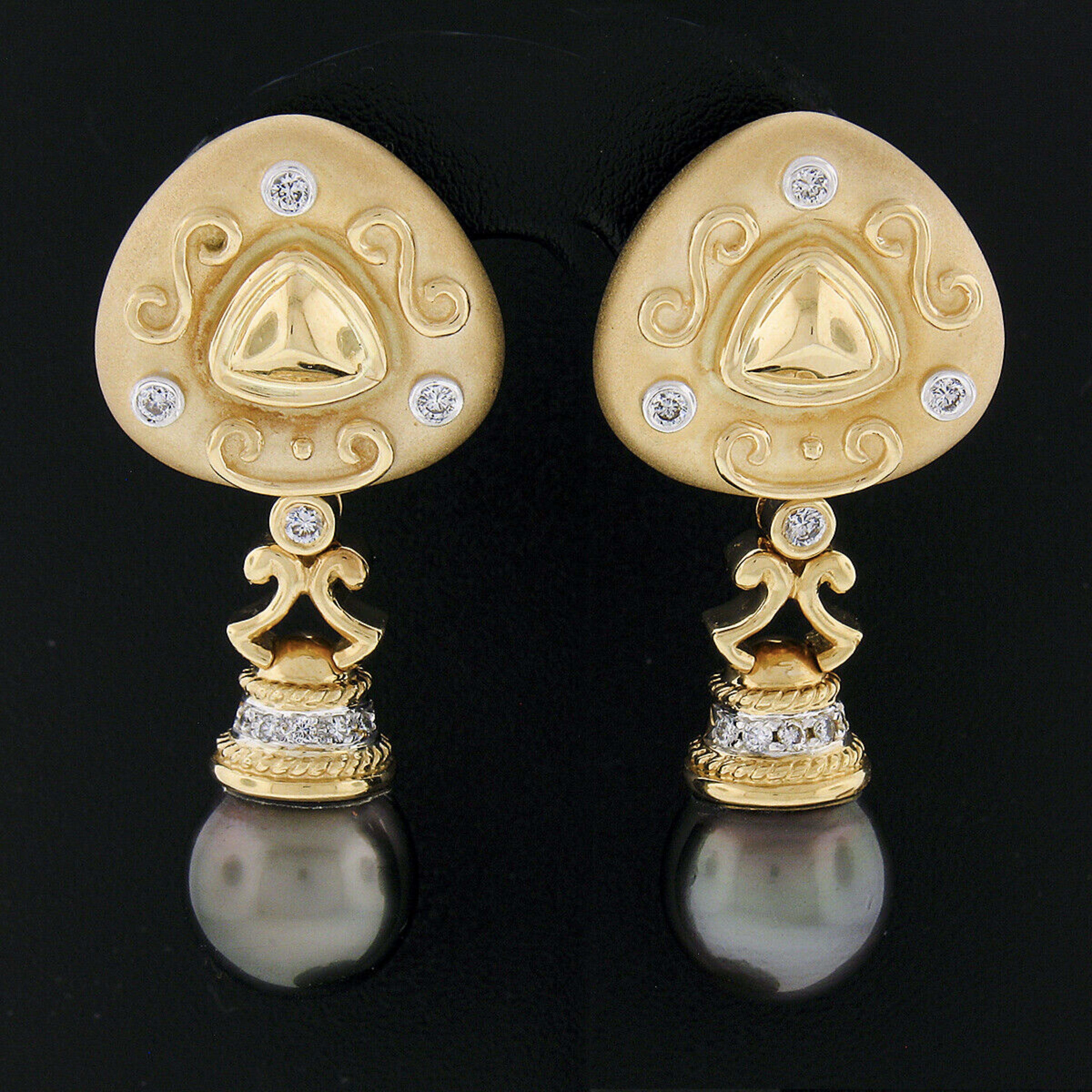 This stunning and truly unique pair of estate diamond and pearl enhancer earrings is crafted in solid 18k yellow gold and features an absolutely elegant design. The top portion displays wonderful matte finish with nice high polished finish detailing