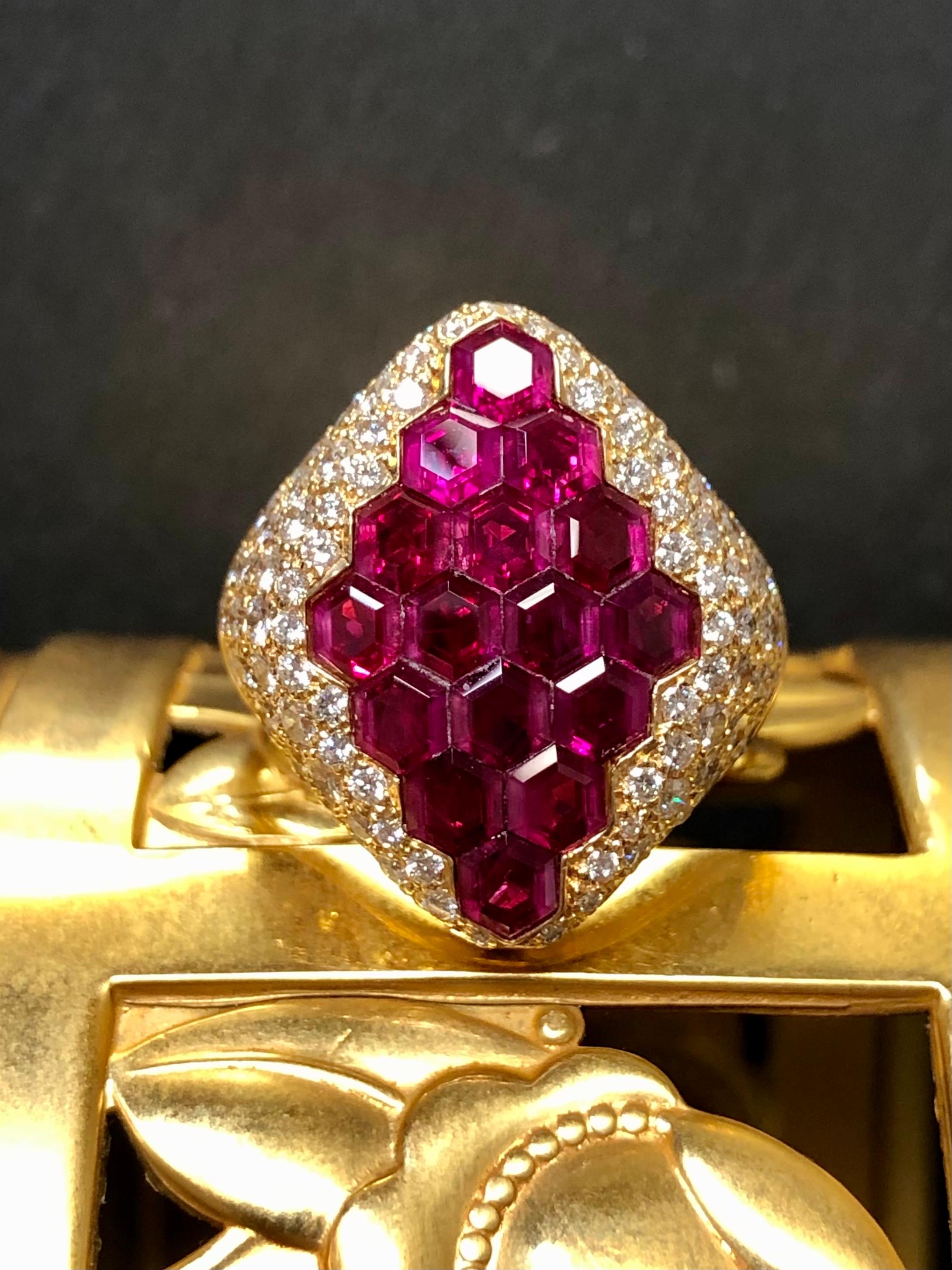If you are a jewelry enthusiast then certainly you have seen invisibly set rubies before… But have you ever seen hexagonal cut invisibly set rubies? We haven’t! This ring is incredible and goes beyond regular stone setting. It’s a newer piece made