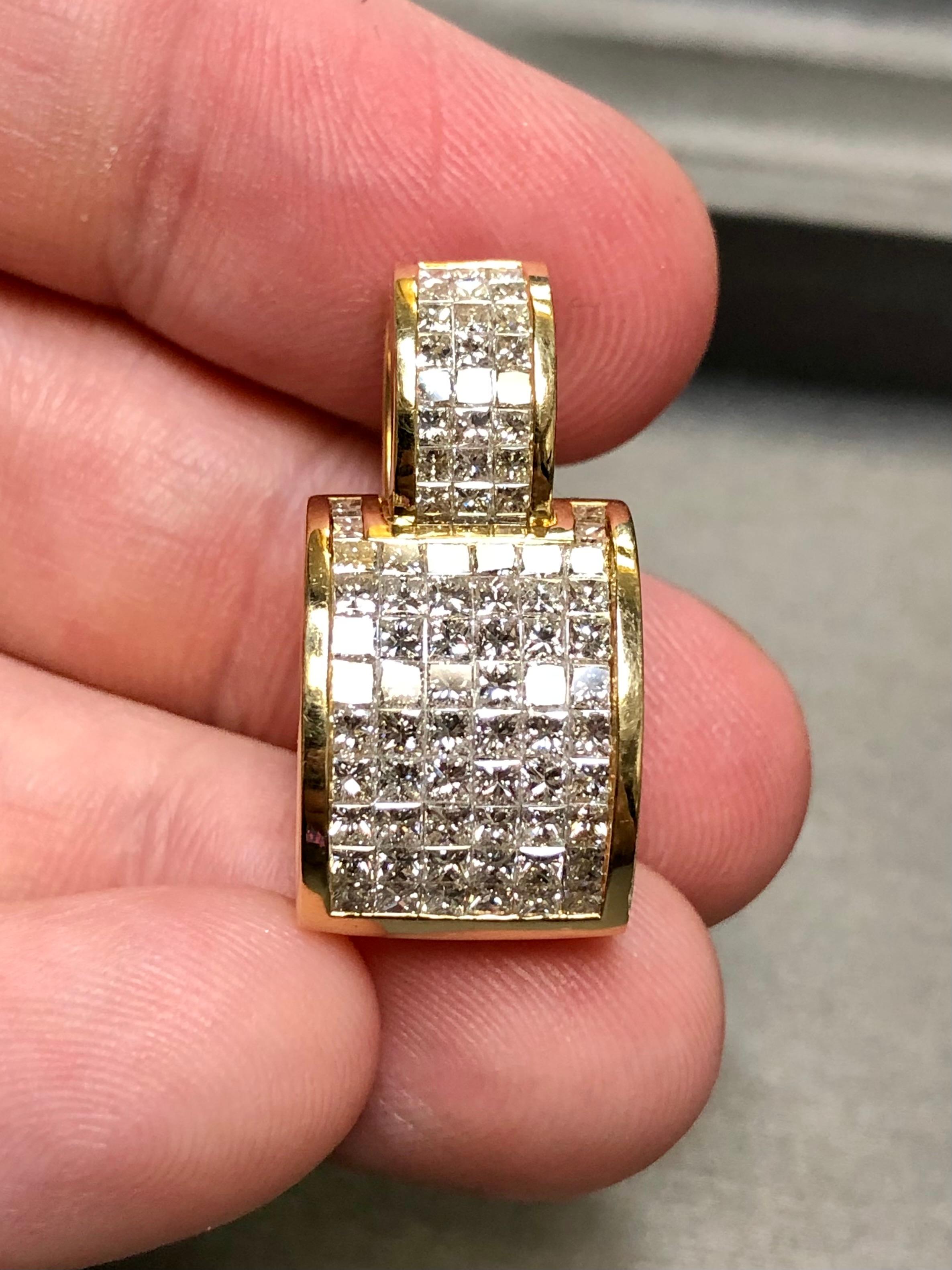 
A bold statement piece done in 18K yellow gold and invisibly set with approximately 4.92cttw in G-I color Vs1-2 clarity princess cut diamonds. A gorgeous piece that makes no excuses… at all!


Dimensions/Weight:

Measures 1.1” tall and .50” wide