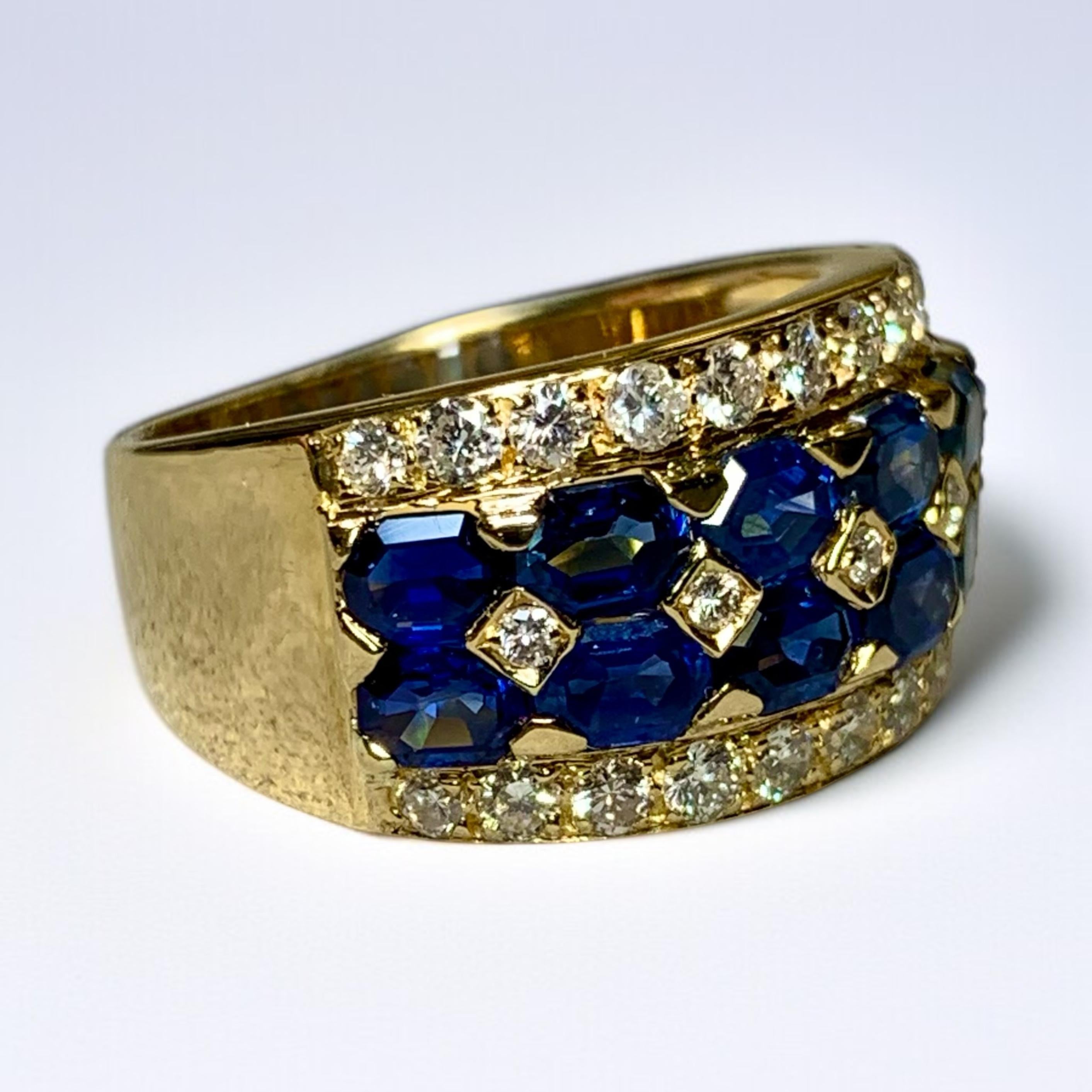 An elegant wide band cocktail ring done in deep 18K yellow gold and shared-prong set with custom cut lozenge shape bright blue natural sapphires and .60ctw in round diamonds ranging G-H color and Vs12 clarity.


Dimensions/Weight:

Ring measures