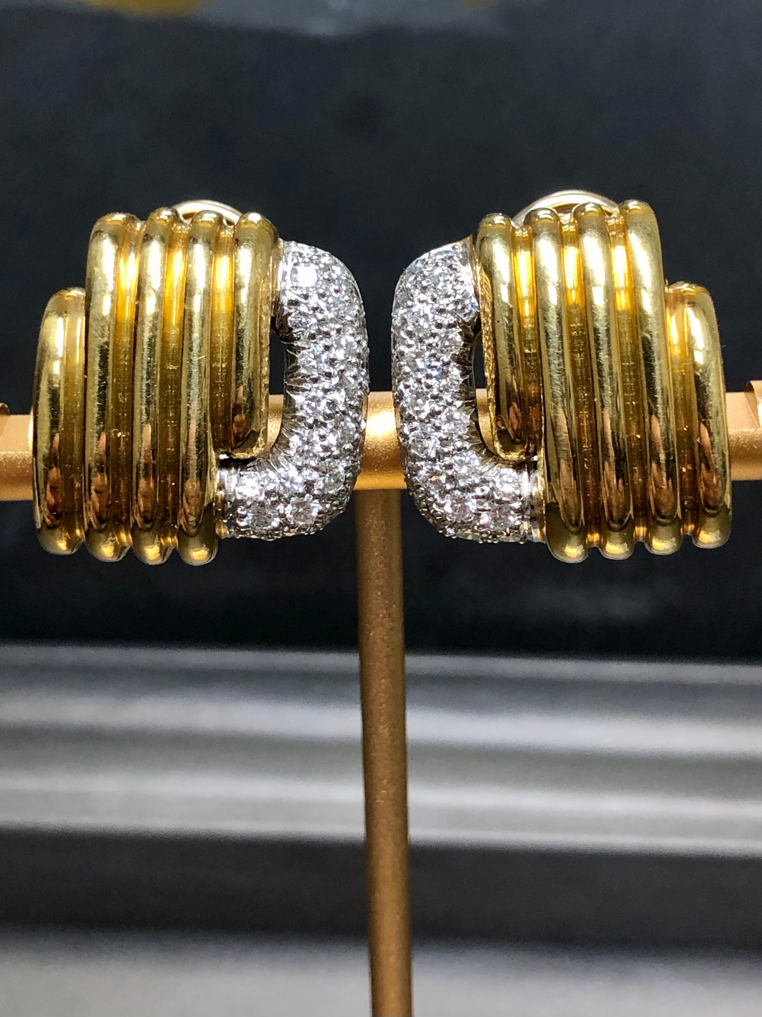 An original pair of clip-on huggies by designer Marlene Stowe done in 18K yellow gold and platinum and set with approximately 1.50cttw in G-H color Vs1-2 clarity round diamonds.


Dimensions/Weight:

Earrings measure .75” in diameter and weigh