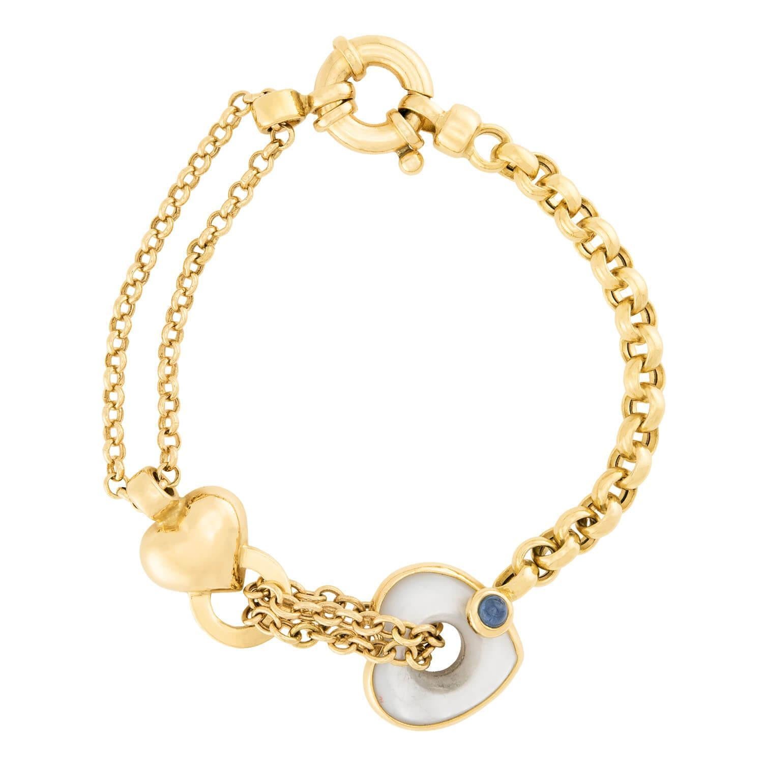 A romantic earring and bracelet set! Crafted in 18k vibrant yellow gold, the set features a pair of dangle earrings. The earrings begins with a gold heart-motif surmount, which features an attached half circle. Two strands of thin chain are woven