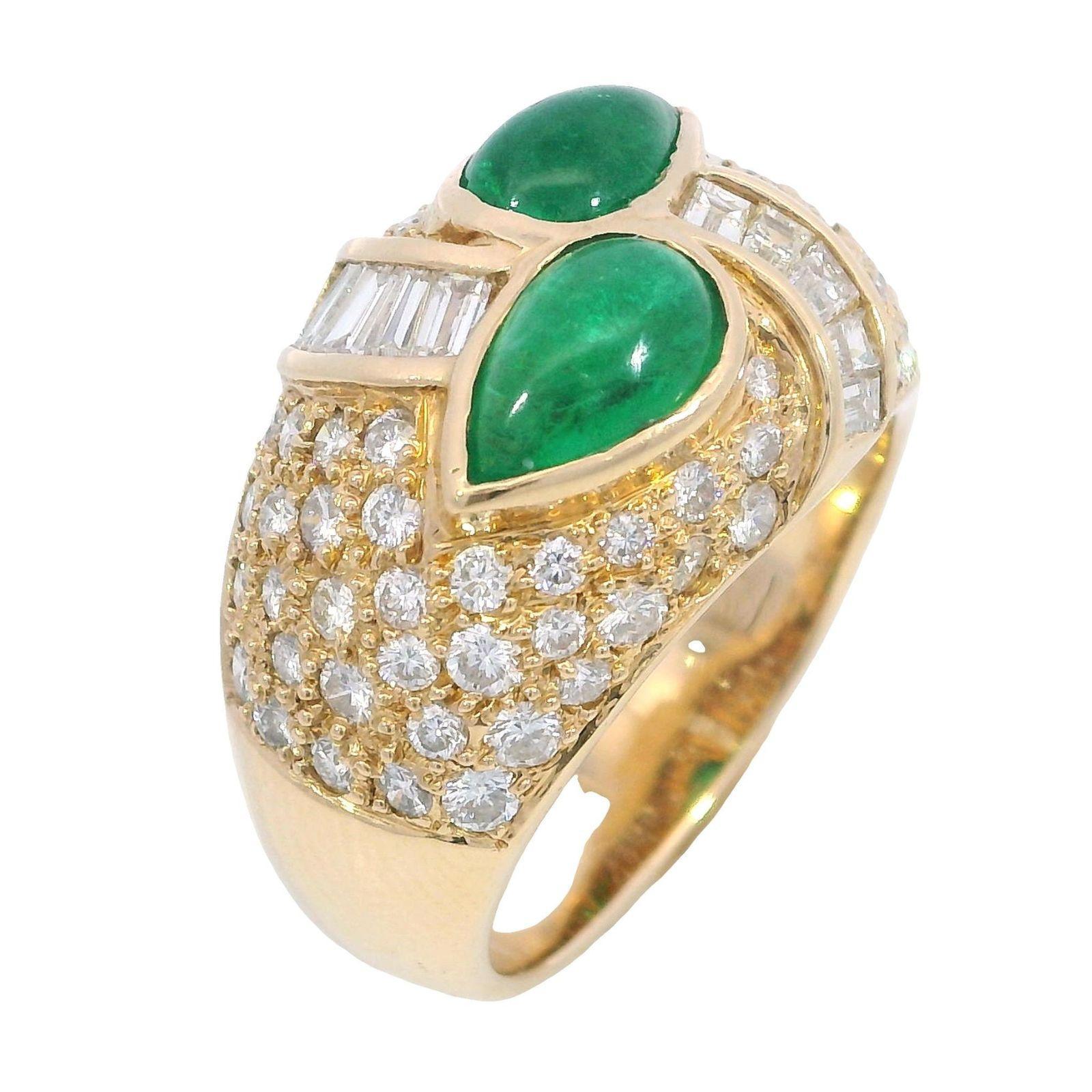 Estate 18K Pave Diamond Cocktail Ring Emerald Cabochon 18k Yellow Gold ~3.81ctw

This 18k yellow gold ring showcases two cabochon-cut emeralds totaling 1.94 carats, their rich green hue offering a vivid focal point.

Surrounding the emeralds, 1.87