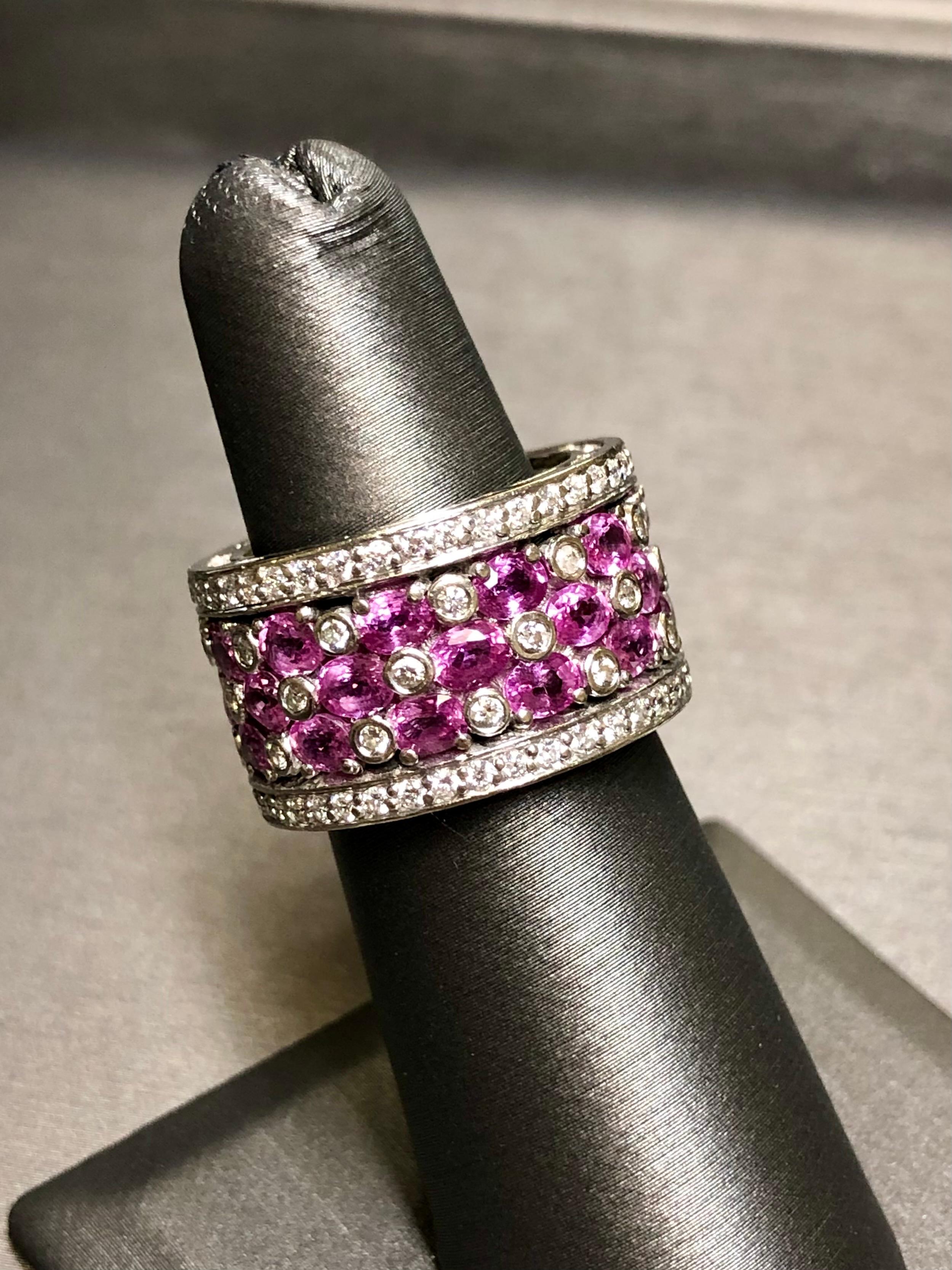 
A fabulously well made band ring done in 18K white gold set with approximately 9cttw in natural, oval cut vibrant pink sapphires (.25 each) as well as 1.86cttw in H-I Vs1-2 clarity round diamonds. Not your average band.


Dimensions/Weight:

Ring