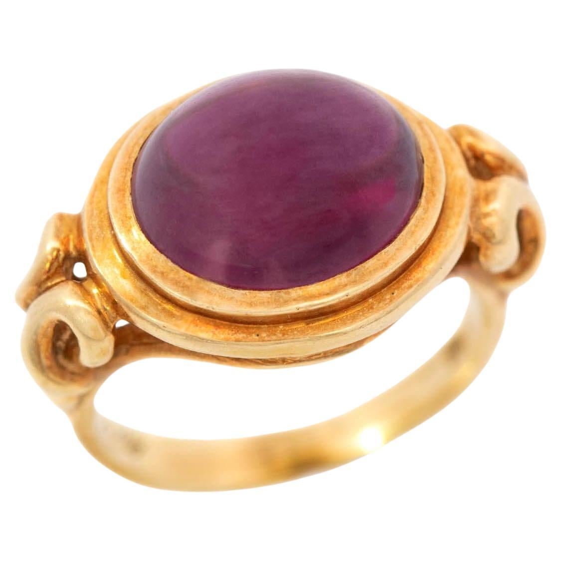 Bague de succession 18 carats en rhodolite grenat cabochon