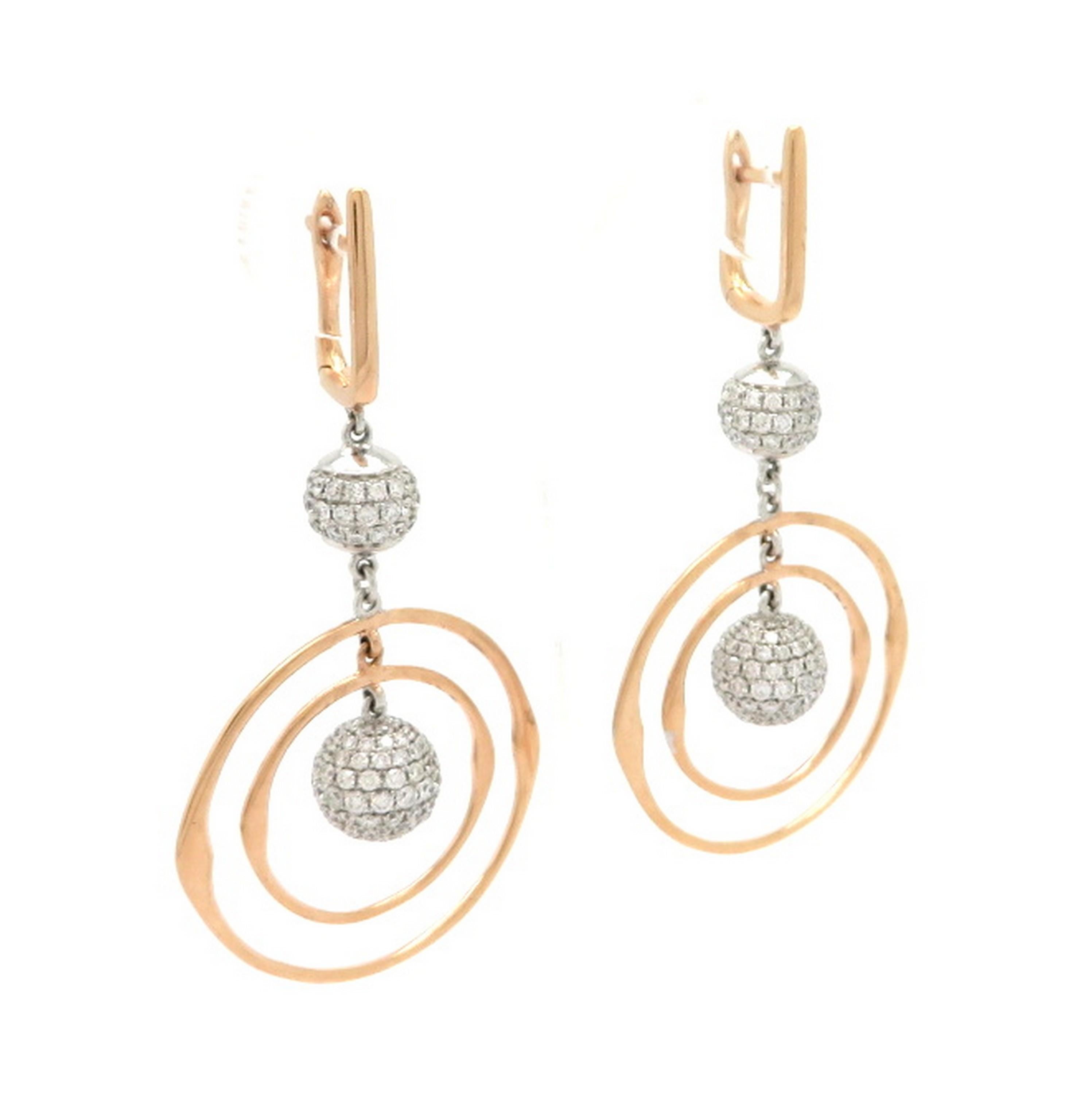 Estate 18K two-tone rose and white gold pave diamond circle earrings. Showcasing 308 pave set round brilliant cut diamonds, weighing a total of 3.01 carats. Diamond grading: color grade: H – I. Clarity grade: VS1. Each earring measures 2-1/8” inch