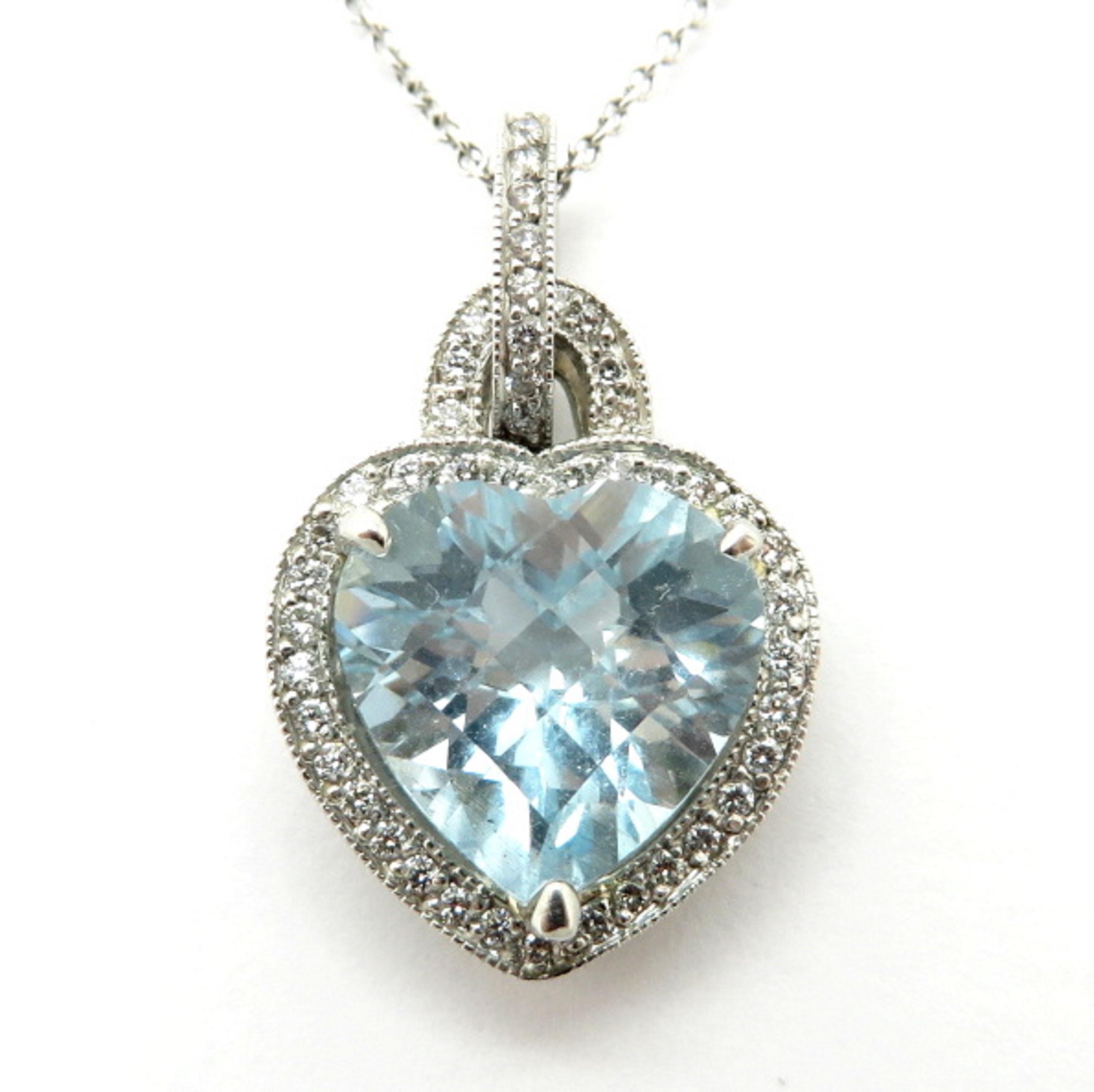 Estate 18K white gold aquamarine and diamond heart pendant necklace. Showcasing one heart shaped checkerboard faceted aquamarine gemstone weighing approximately 3.32 carats. Interspersed through the pendant are 86 round brilliant cut diamonds