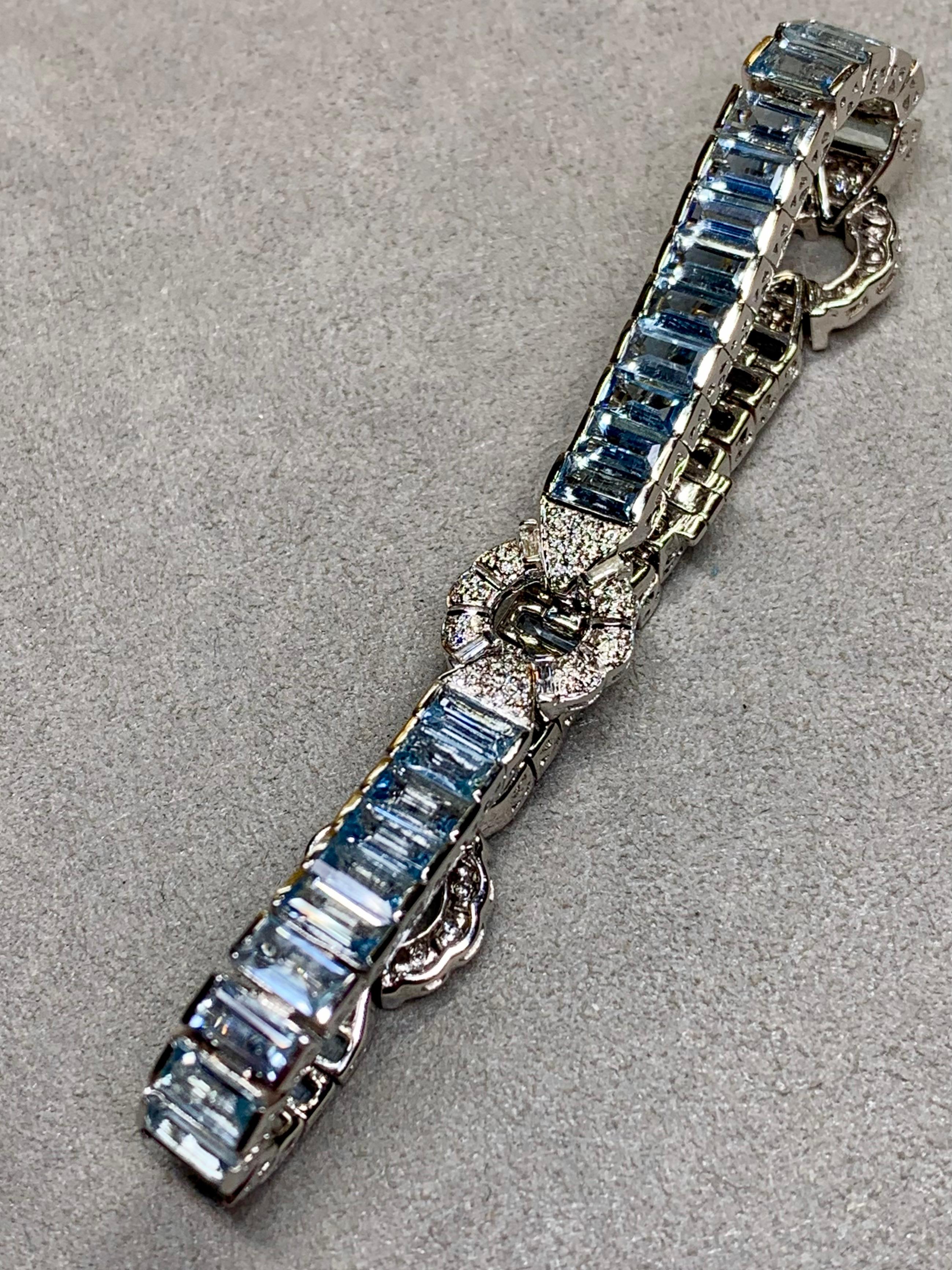 A wonderfully unique bracelet done in 18K white gold, and set with approximately 20ctw in natural medium blue baguette cut aquamarines as well as 1.80ctw in round and baguette diamonds averaging H-I color and Vs2-SI1