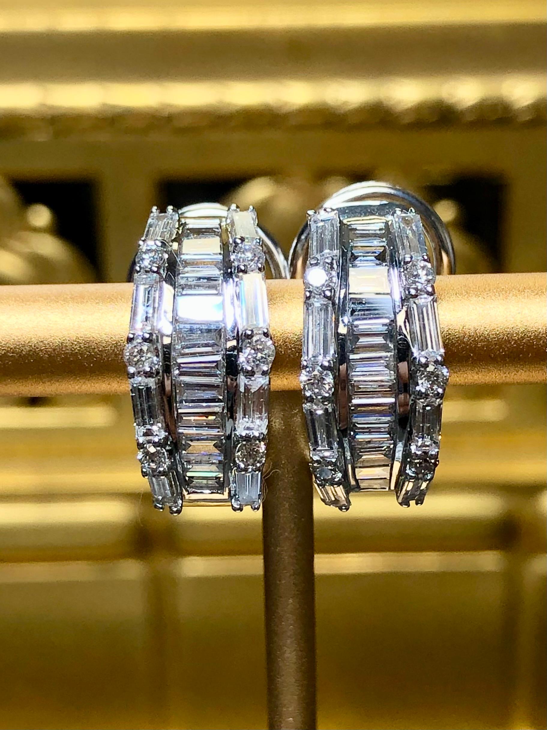 Classic and elegant huggie earrings done in 18K white gold and set with approximately 2.60cttw in G-H color Si1-2 clarity bright and lively round and baguette diamonds. These earrings have posts with omega backs.


Dimensions/Weight:

Earrings