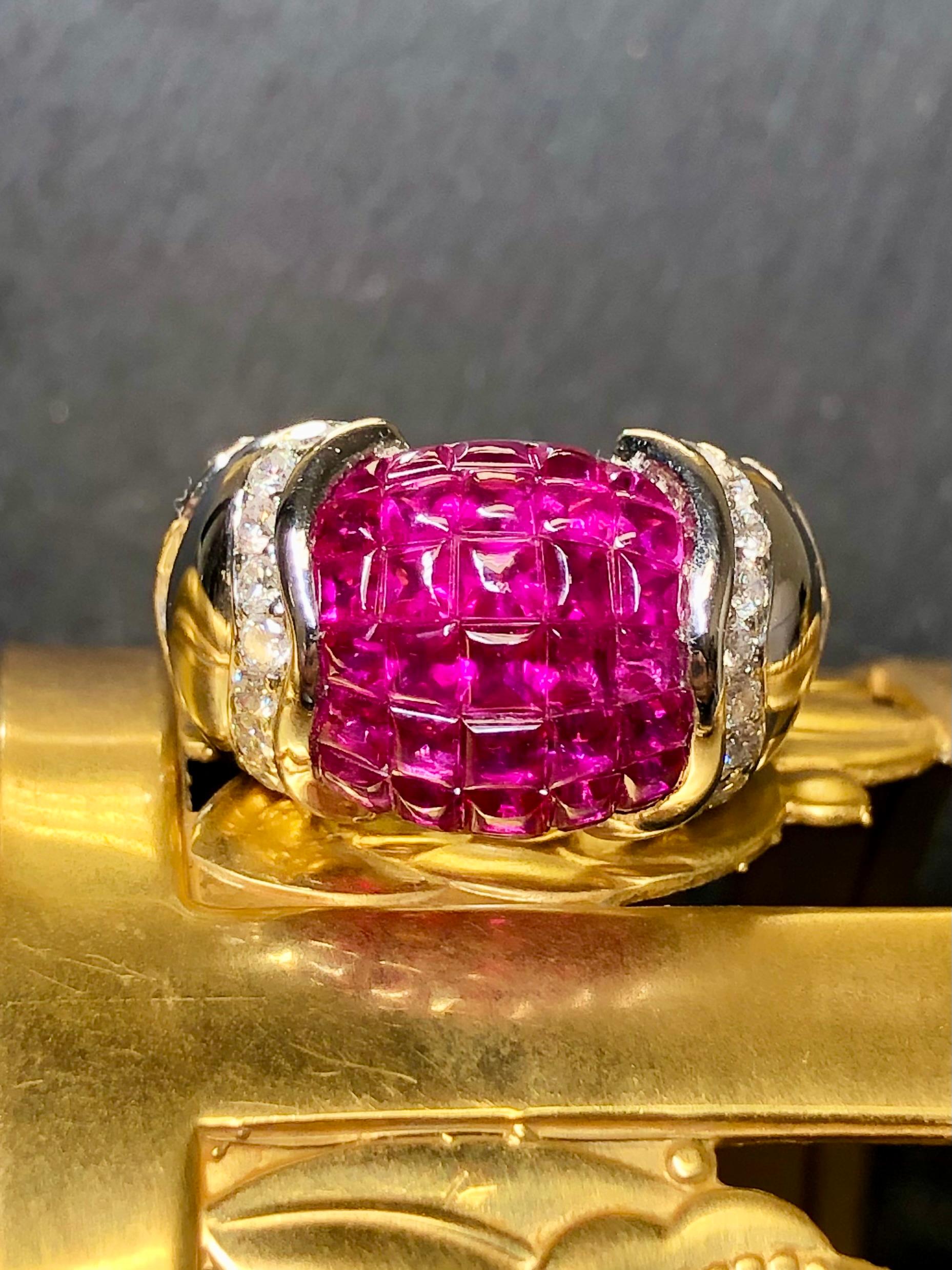 A solidly crafted contemporary cocktail ring done in 18K white gold and invisibly set with approximately 5cttw in buff top natural red rubies as well as .54cttw in G-I color Vs1-2 clarity round diamonds.


Dimensions/Weight:

Ring measures .55” wide