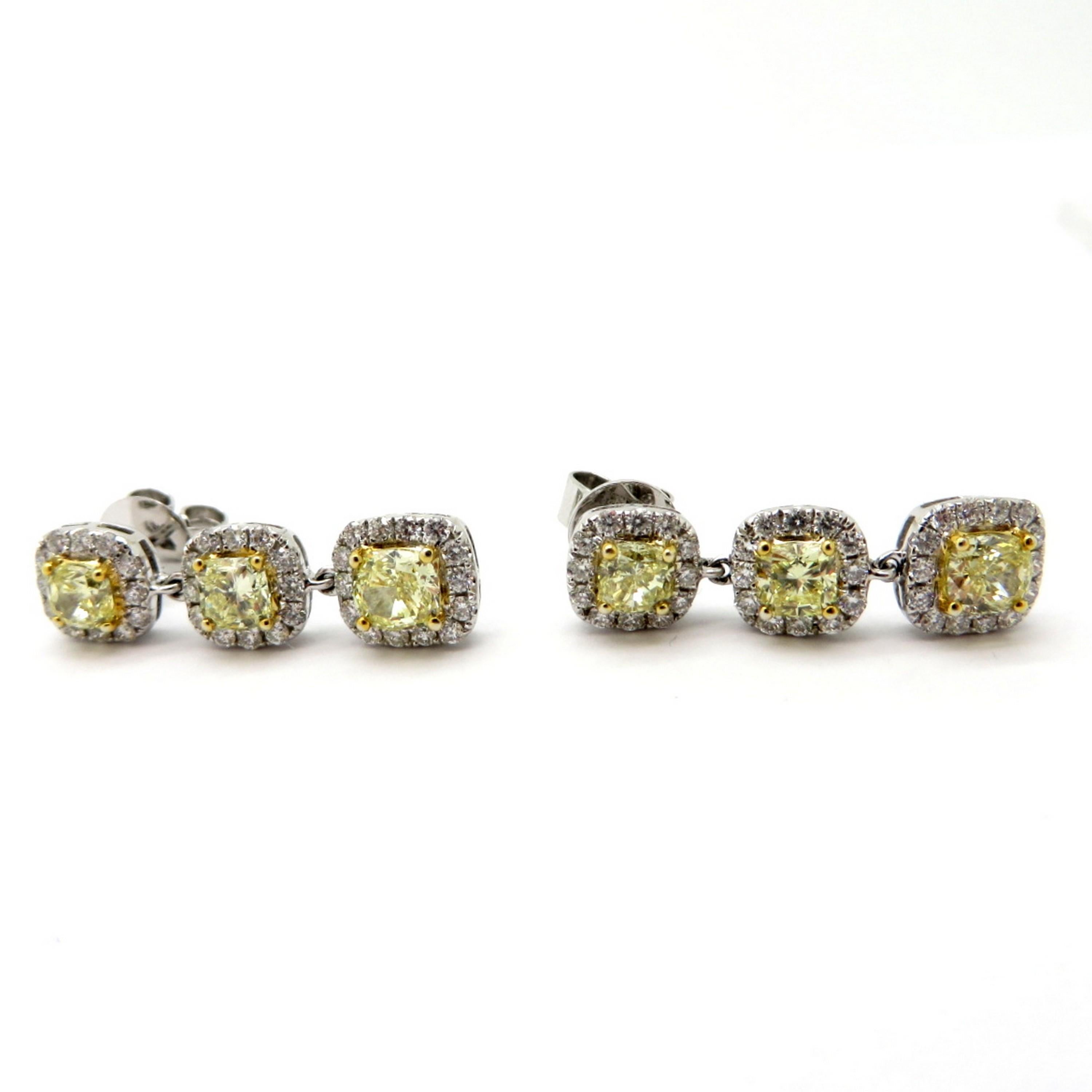 Estate 18 Karat White Gold Fancy Yellow Cushion Diamond Dangle Halo Earrings In Excellent Condition For Sale In Scottsdale, AZ