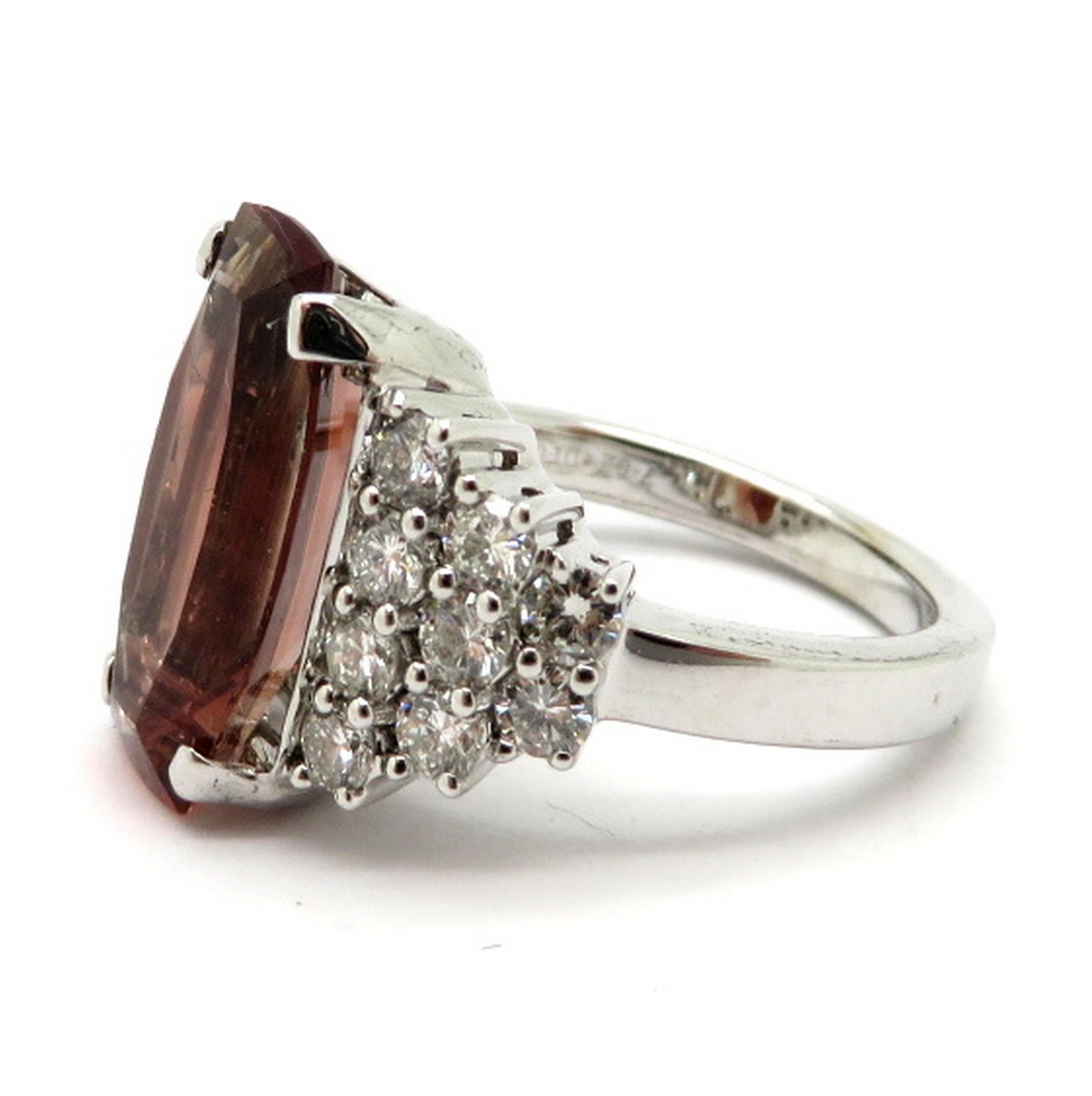 Estate 18K white gold feldspar and pave diamond fashion statement ring. Showcasing one fine quality feldspar gemstone weighing approximately 7.62 carats. Accented with 20 round brilliant cut prong set diamonds weighing approximately 1.04 carats.