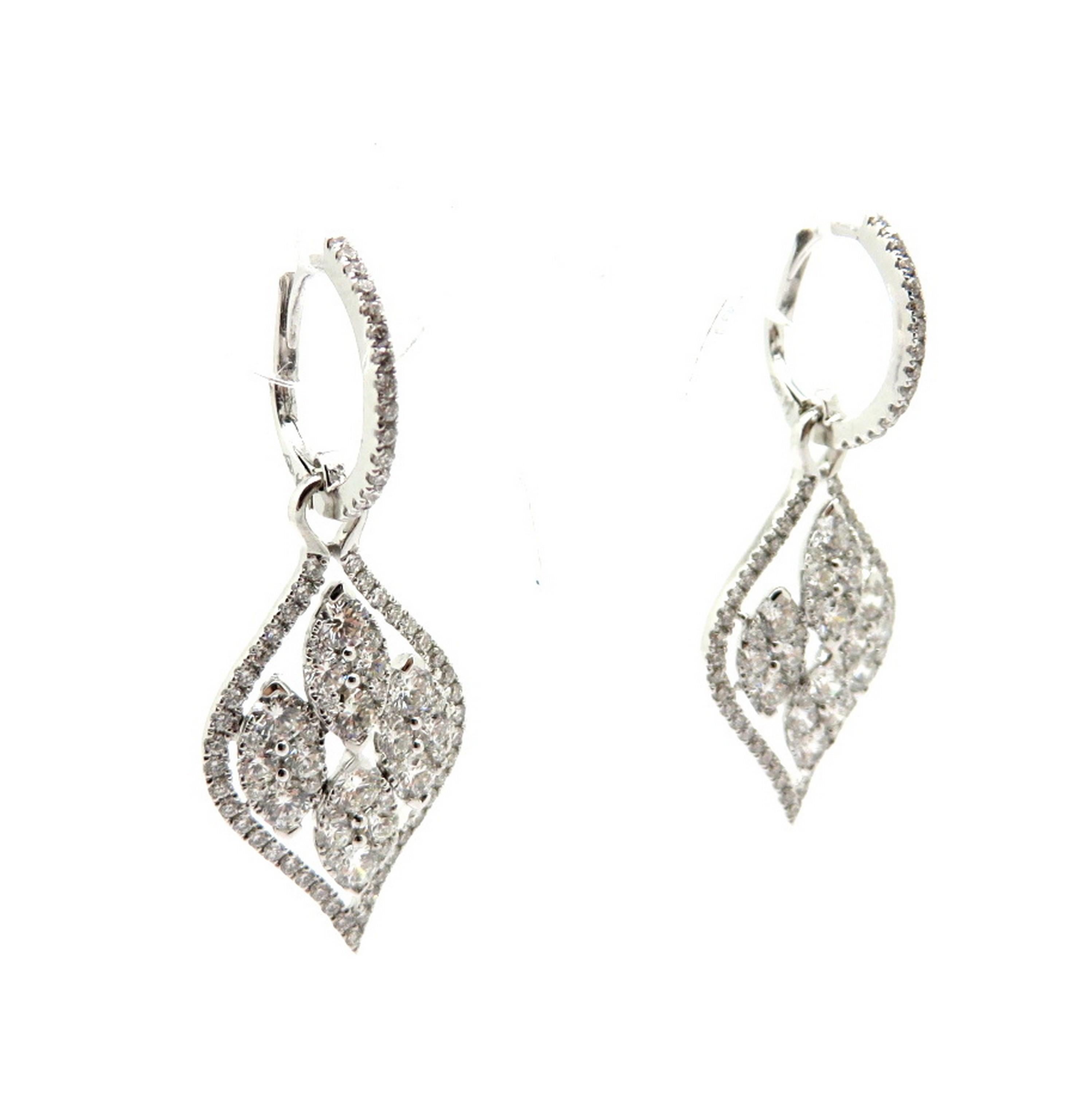 Estate 18K white gold round diamond dangle earrings. Displaying 176 round brilliant cut diamonds, micro prong set, with various measurements, weighing a combined total of approximately 2.97 carats. Diamond grading: color grade: G – H. Clarity grade:
