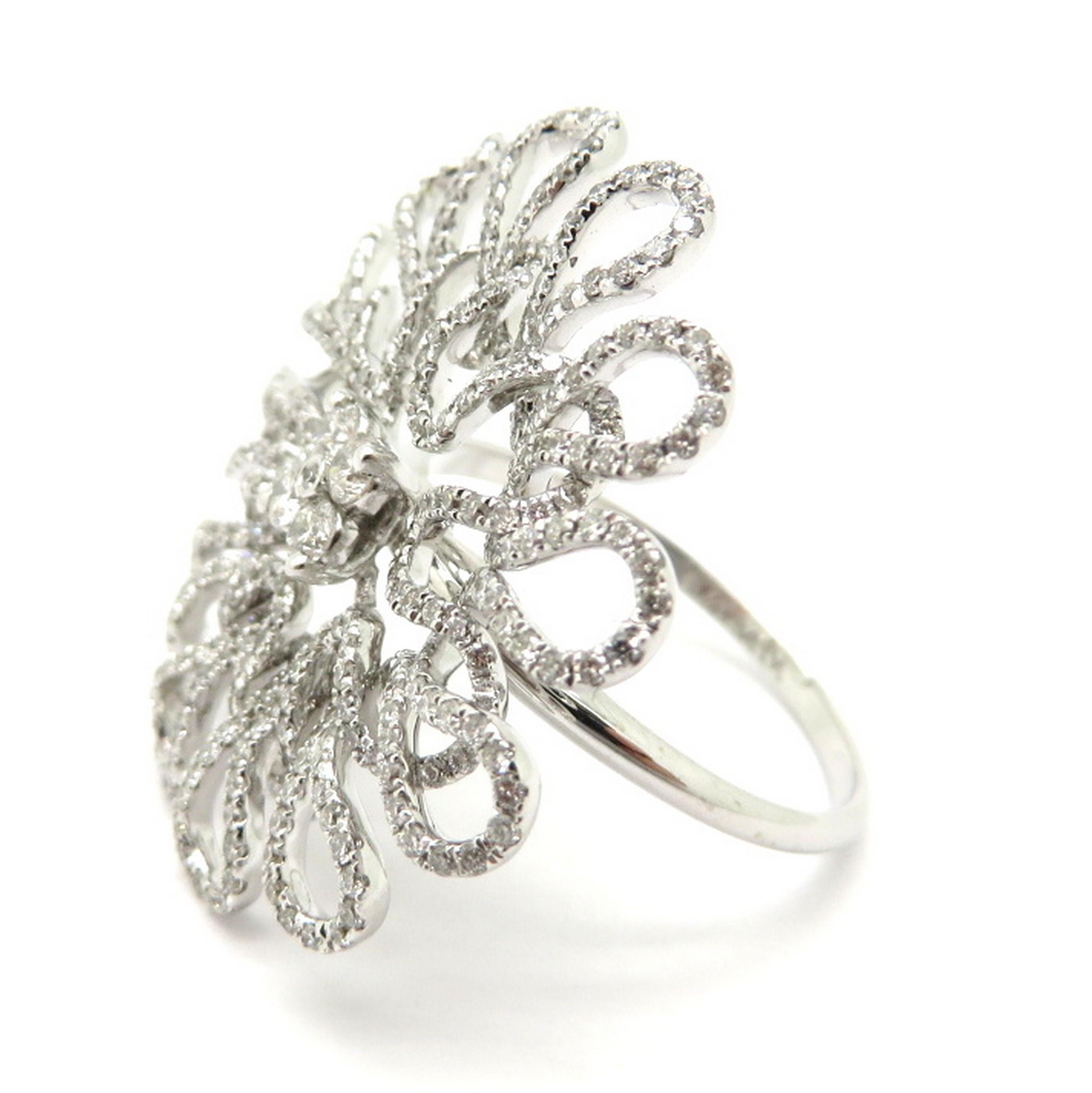 Estate 18K white gold round diamond freeform fashion statement ring. Showcasing five round brilliant cut diamonds weighing approximately 0.08 carats and 378 round brilliant cut diamonds weighing a combined total of approximately 1.08 carats. Diamond