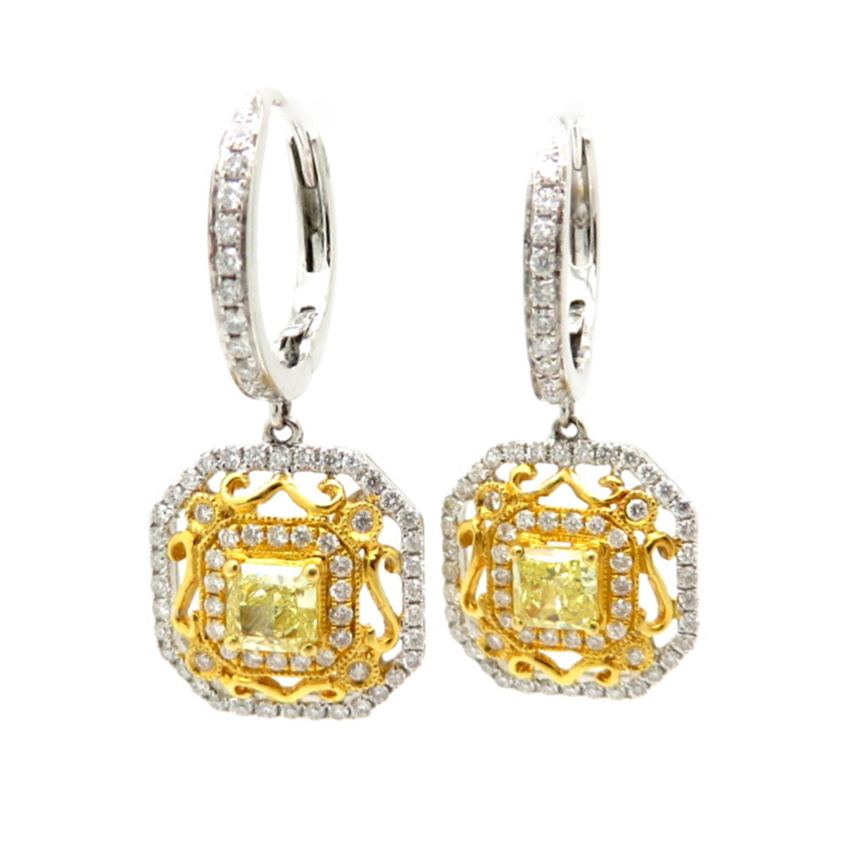 For sale is a lovely pair of Fancy Yellow Radiant Cut and White Diamond Dangle Earrings crafted out of 18K White and Yellow Gold!
Each earring centers one radiant cut fancy yellow diamond with SI1 Clarity, weighing a combined total of 0.86 carats.