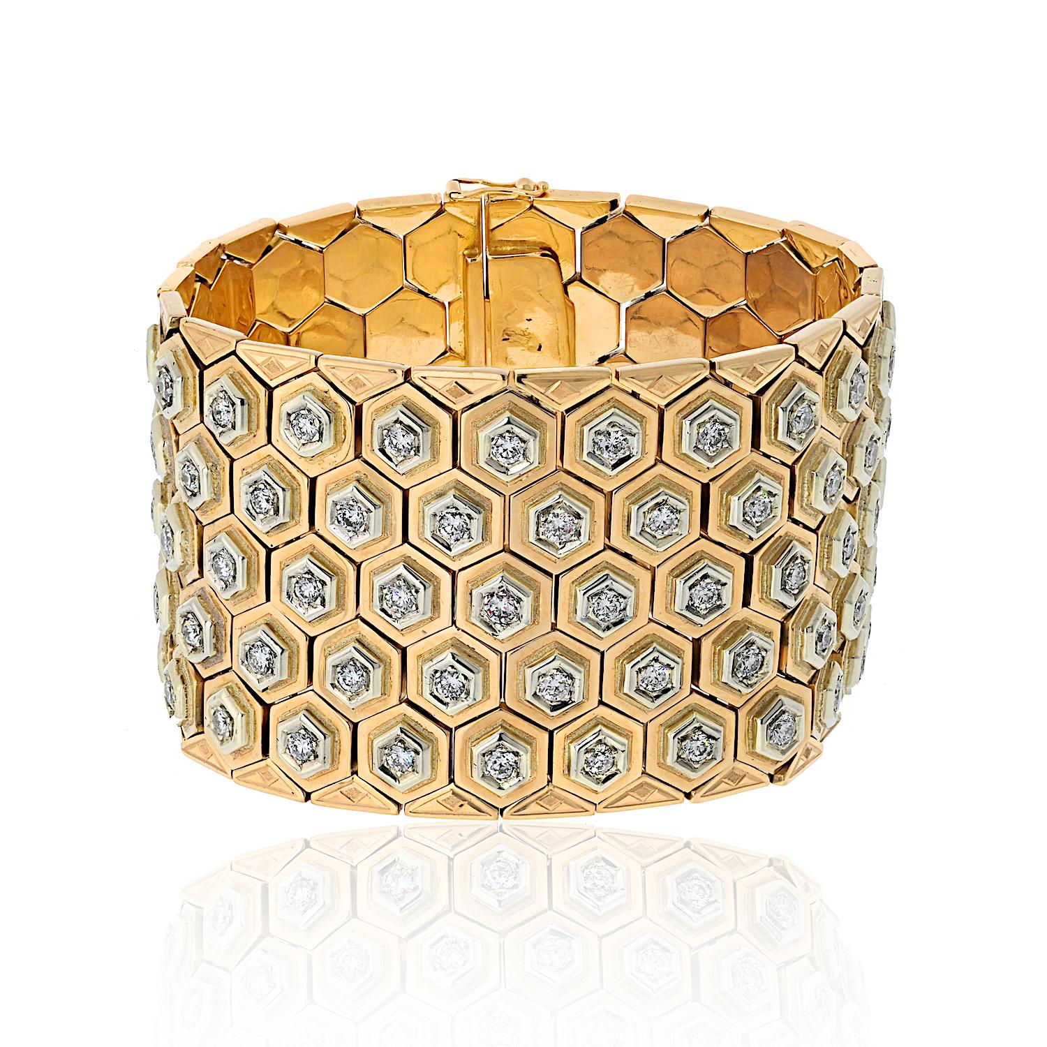 This stunning vintage bracelet features a bold and elegant honeycomb motif, crafted in 18K yellow gold. Set with approximately 12.00 cttw of round-cut diamonds, it sparkles with brilliance while exuding retro sophistication.  

Designed for larger