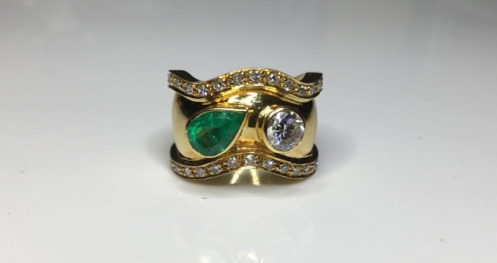 Estate 18K Yellow Gold 2.15 CTW Natural Colombian Emerald & Diamond Ring Sz 6

One Pear Shaped Natural Colombian Emerald, Weighing Approximately 1.00 Carat Total Weight.

One Round Brilliant Cut Natural Diamond, Weighing Approximately 0.65 Carat
