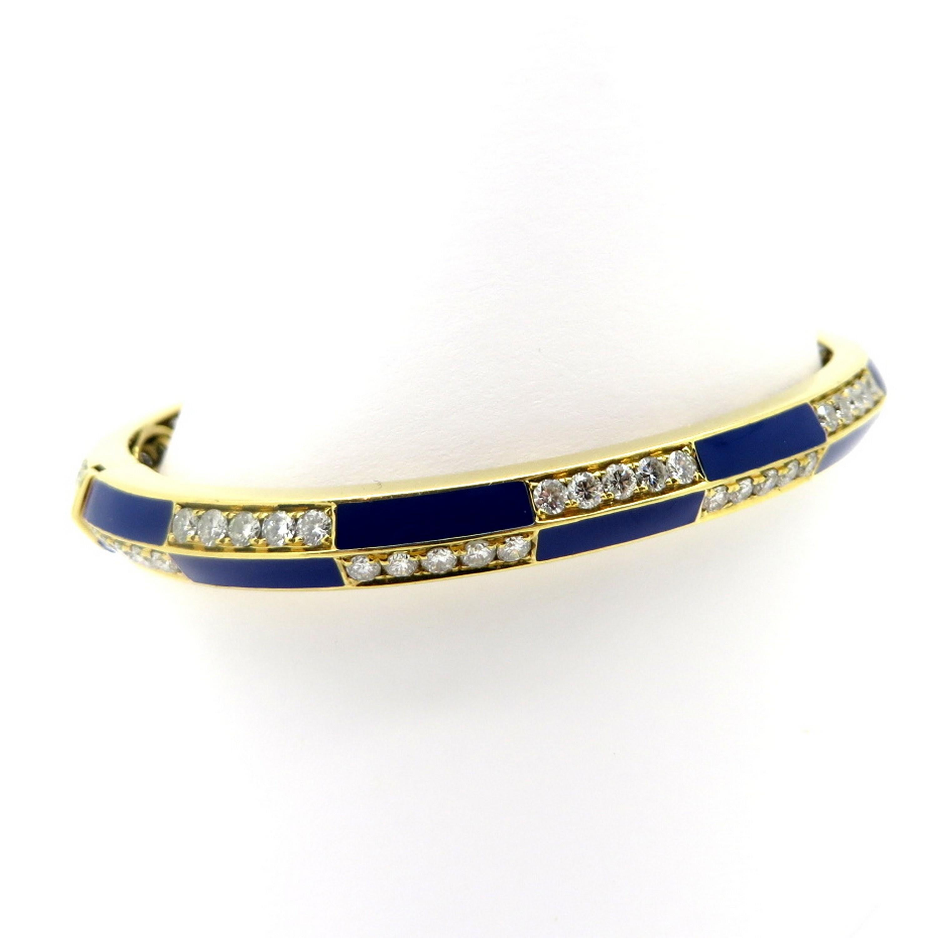 Estate 18K yellow gold 4.60 carat round diamond blue enamel bangle bracelet. Showcasing 77 round brilliant cut micro prong set diamonds weighing a combined total of approximately 3.72 carats. Diamond grading: color grade: G – H. Clarity grade: SI1.