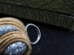 Boucles d'oreilles tourbillon en or jaune 18 carats et diamants