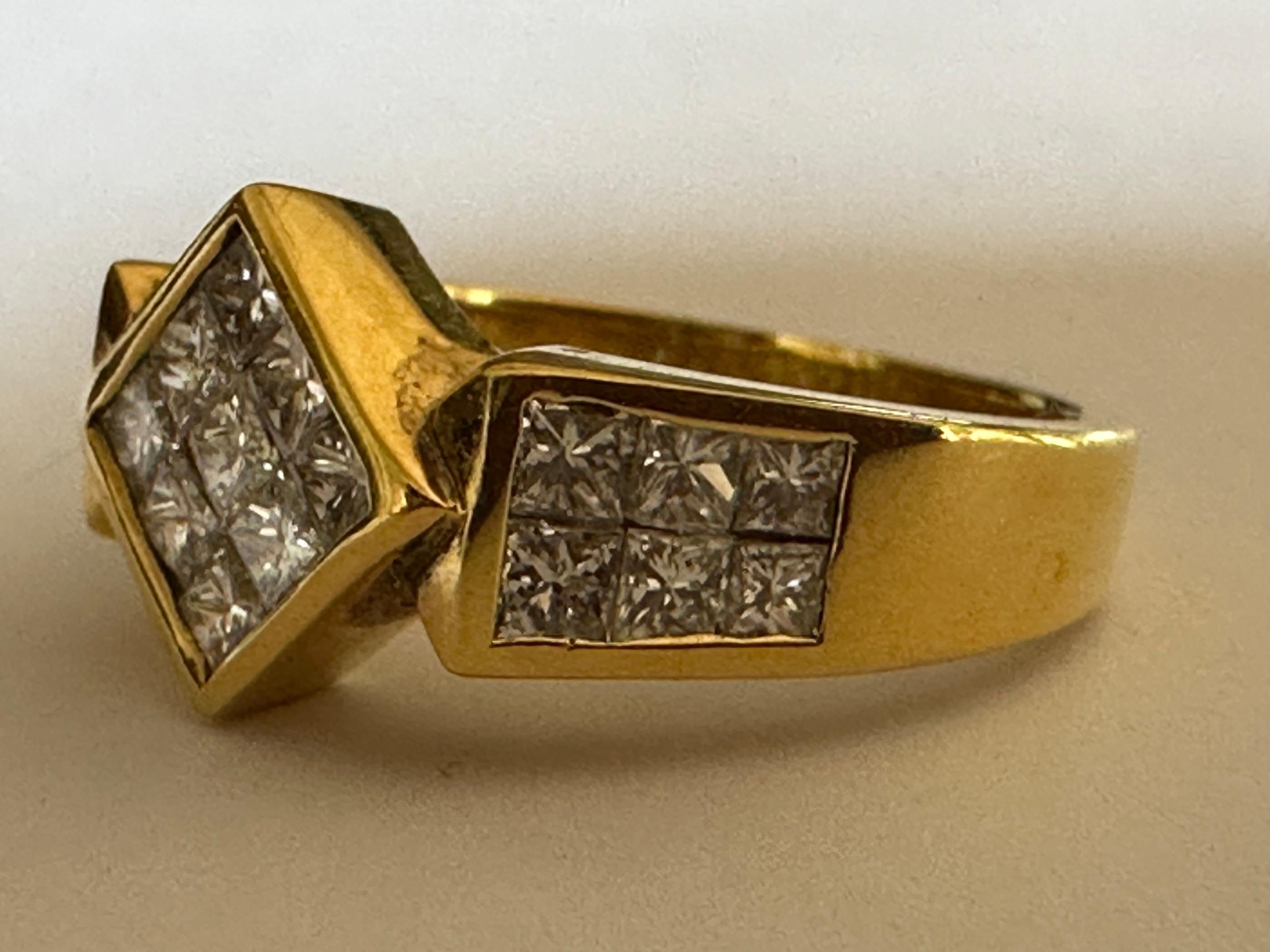Twenty-one princess-cut diamonds totaling approximately 1.41 carats sparkle from an invisible setting in this handsome ring. Set in 18K yellow gold. 
