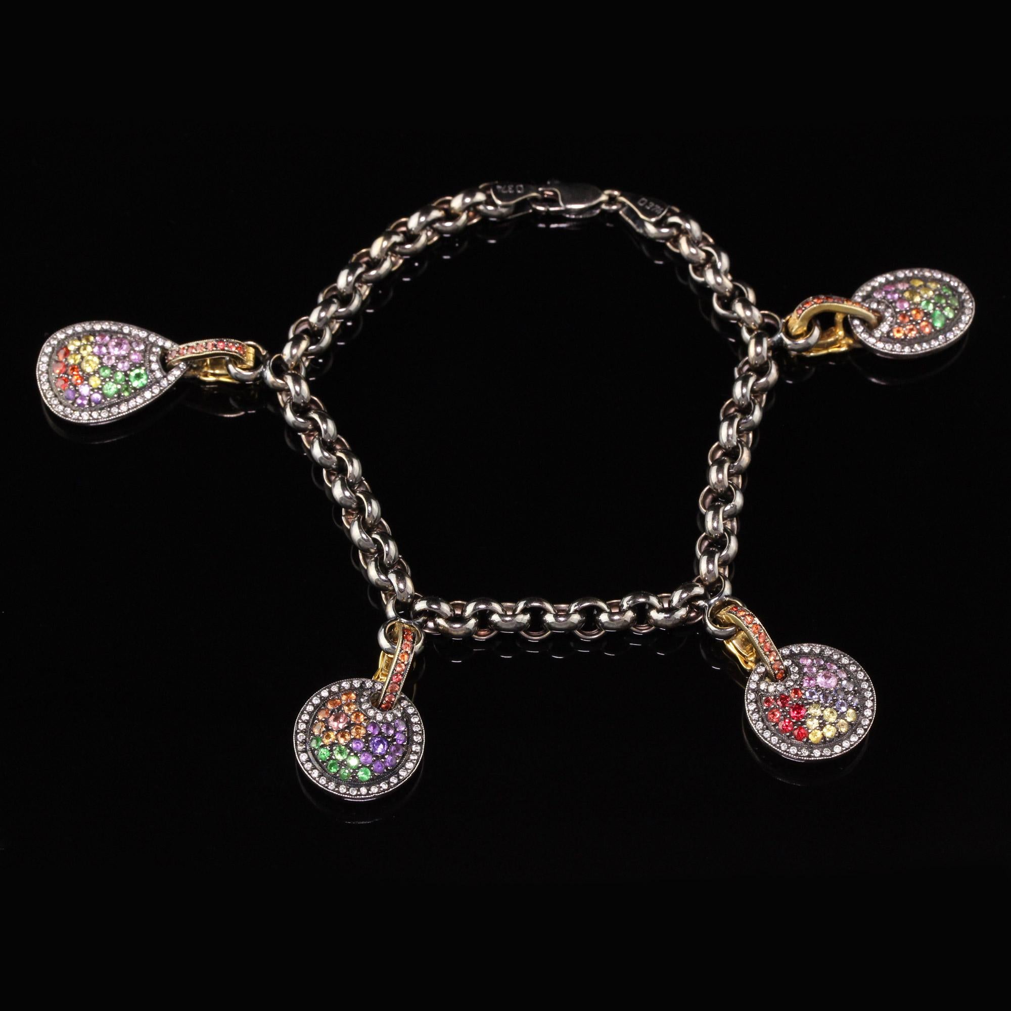 Estate 18 Karat Yellow Gold Black Rhodium Diamond and Gemstone Charm Bracelet In Excellent Condition In Great Neck, NY