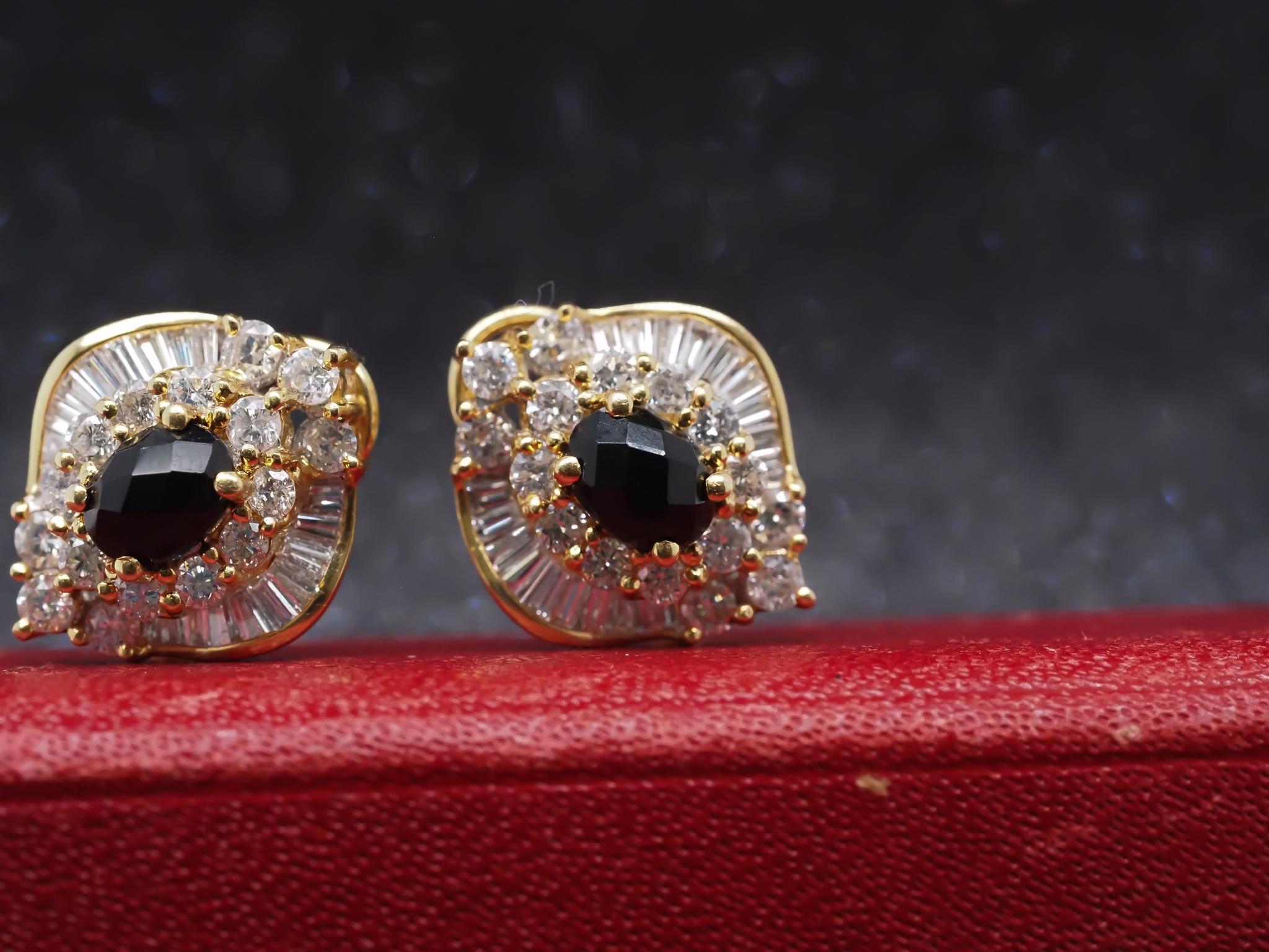 Year: 1990s

Item Details:
Metal Type: 18K Yellow Gold [Hallmarked, and Tested]
Weight: 11.0 grams

Diamond Details:
Weight: 3.50ct total weight
Cut: Round Brilliant and Baguette
Color: F
Clarity: VS

Onyx Details:
Weight: 1.75ct total weight
Cut: