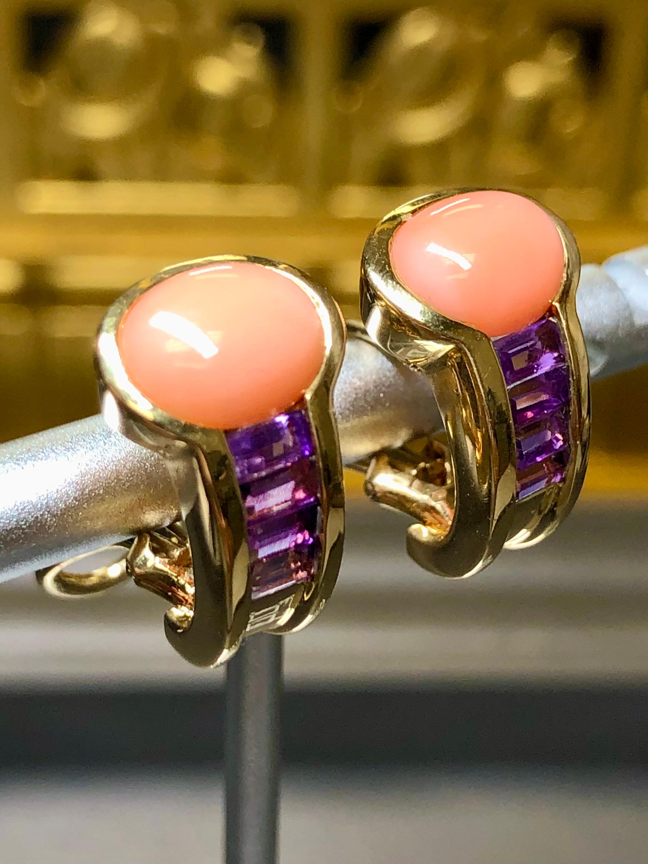 Elegant and bold huggies done in 18K yellow gold both channel and bezel set with numerous baguette cut amethyst and natural cabochon coral. Earrings have posts with omega backs and are signed “Patrick”.


Dimensions/Weight:

Earrings measure .75” by