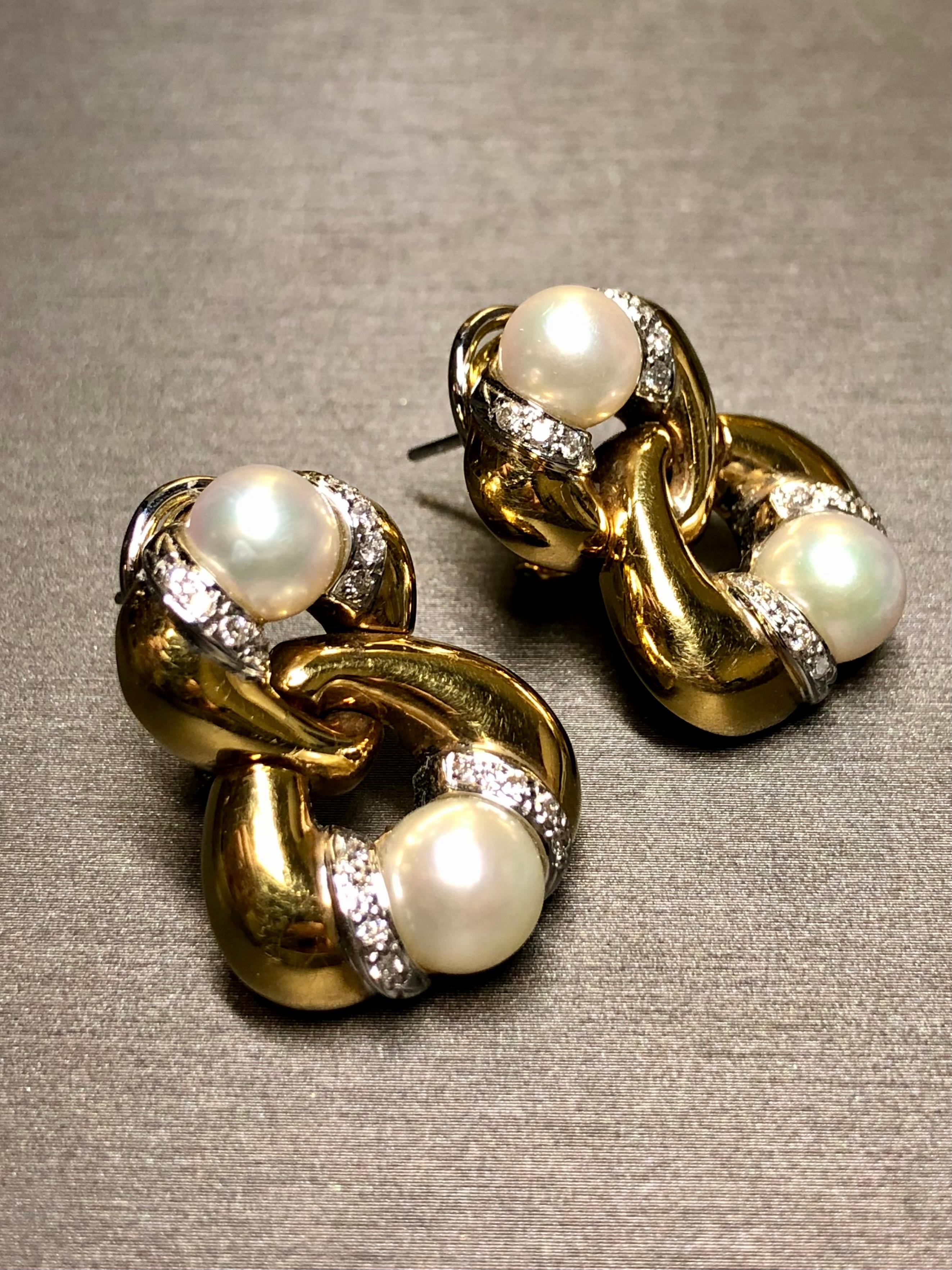 Contemporary Estate 18K Yellow Gold Diamond Pearl Interlocking Omega Back Huggie Earrings For Sale