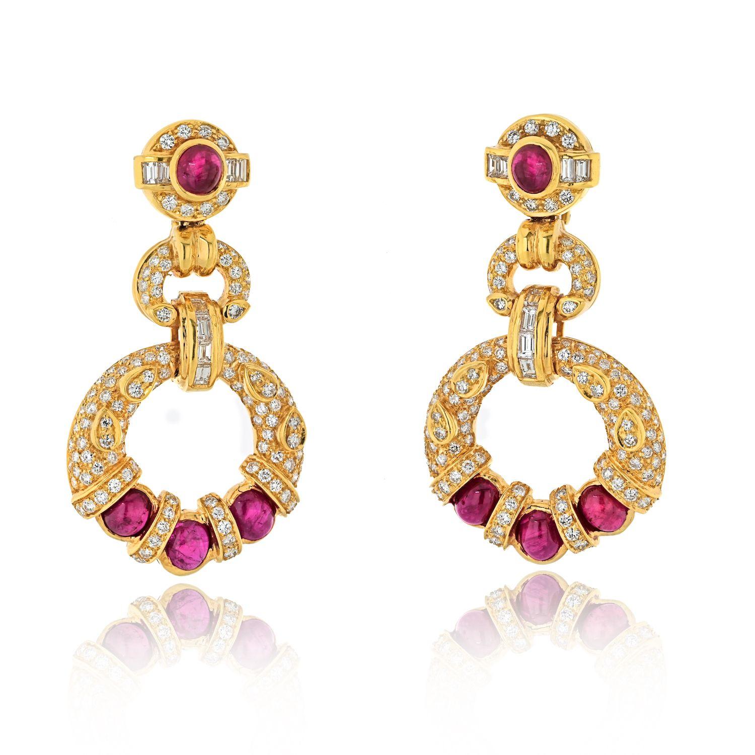 Elevate your jewelry collection with the exquisite Estate 18K Yellow Gold Diamond Ruby Doorknocker Earrings. These enchanting earrings exude a sense of timeless allure, capturing the essence of luxury in every facet. Crafted with meticulous
