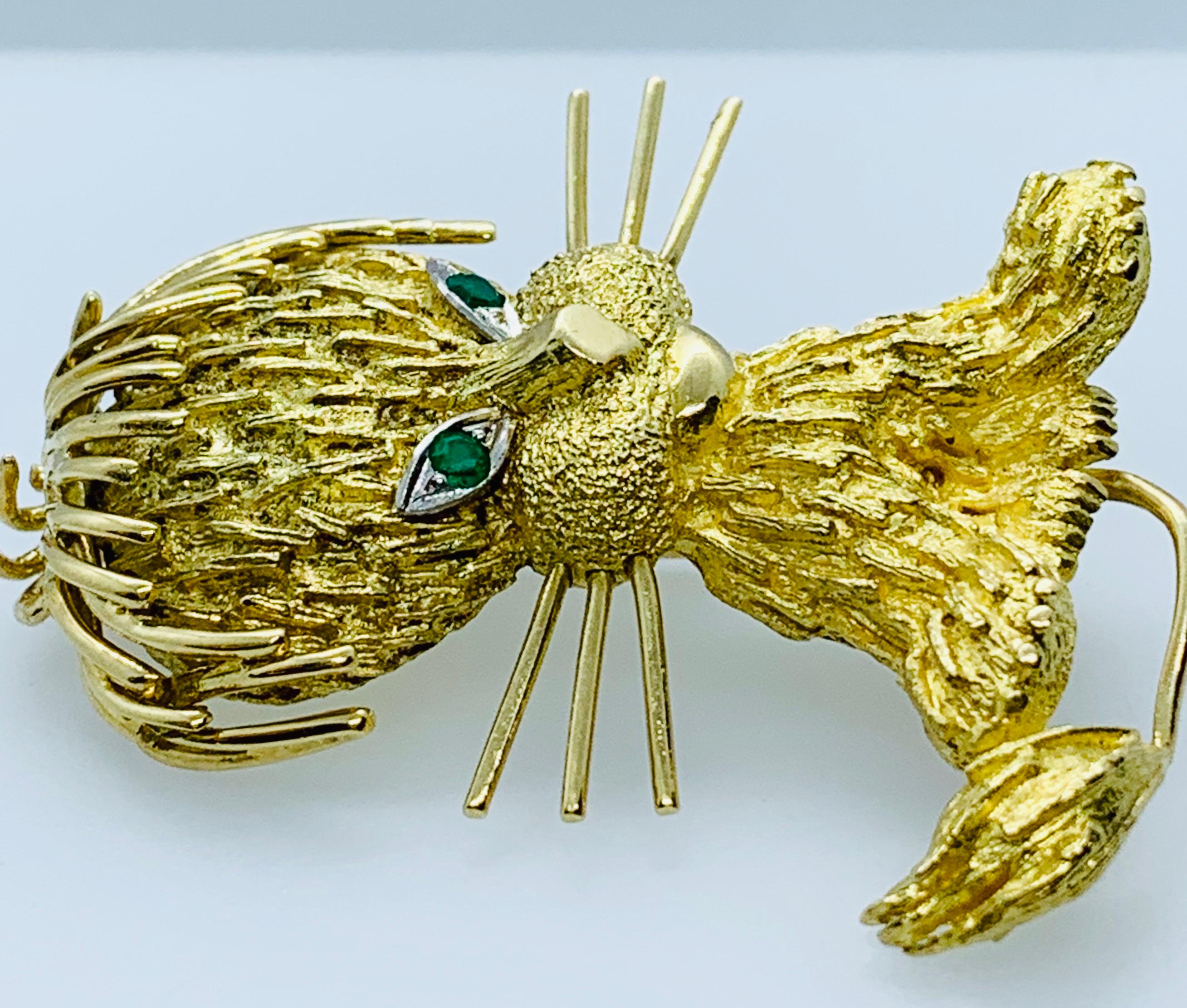 What a whimsical little Lion Cub or Kitty Cat Brooch! This estate piece is made in 18K yellow Gold and has two round emeralds for eyes! As you can see in the photos, the detail work on this piece is amazing! It measures 1&3/4 inches long and 1&1/4
