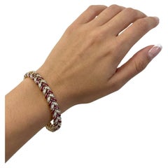Estate 18K Gelbgold Fischgrätenarmband mit Rubinen im Kaliberschliff