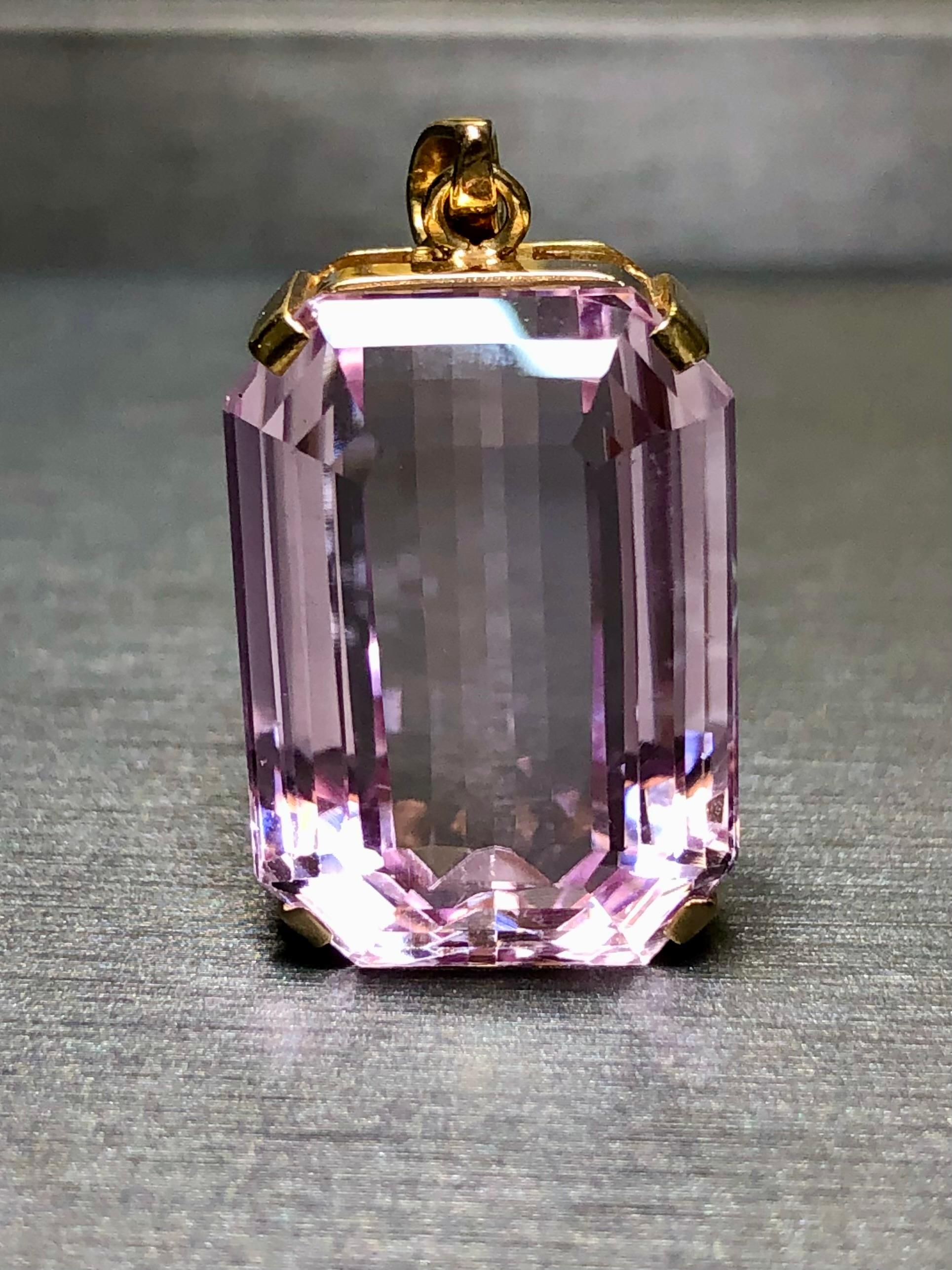 
A simple pendant with a look and a presence. A wonderfully set large 26.20ct Kunzite (22.1×15.76×9.46) surrounded by deep 18K yellow gold.


Dimensions/Weight:

Pendant measures 1.25” x .55” and weighs 10.2g.


Condition:

Stone is free of chips