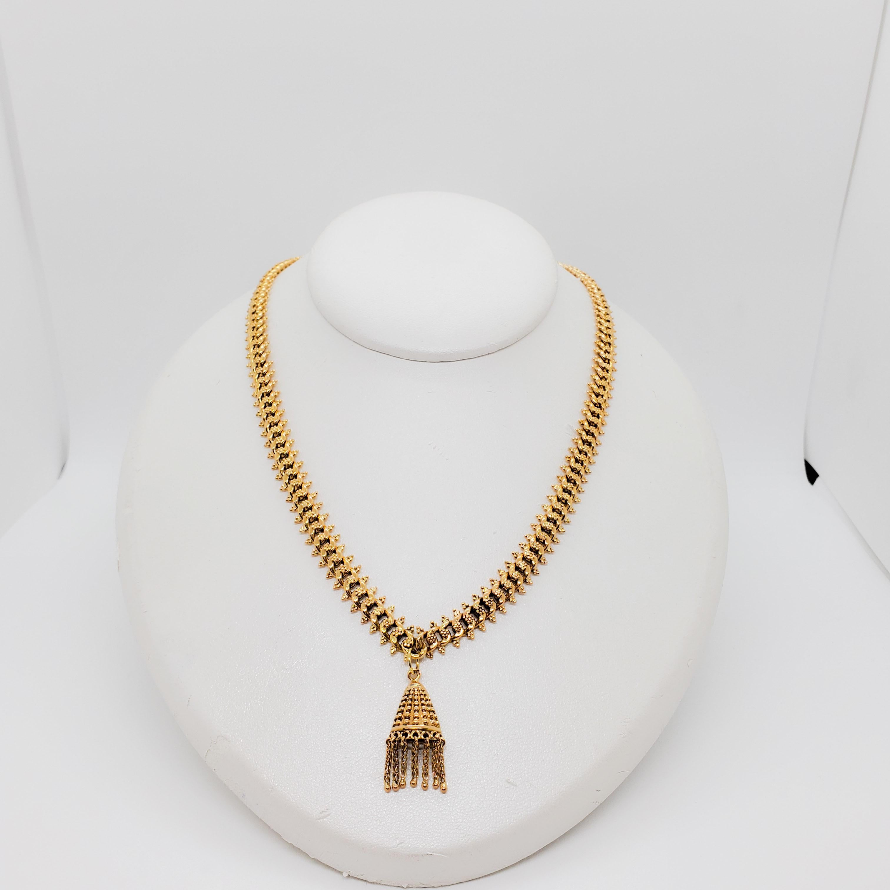Beautiful 18k yellow gold necklace with a tassel pendant.  Excellent condition. 17